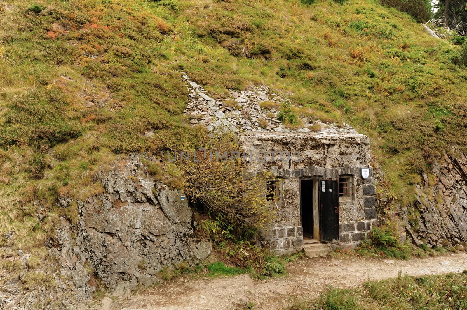 Bunker built in the rock with a small footpath