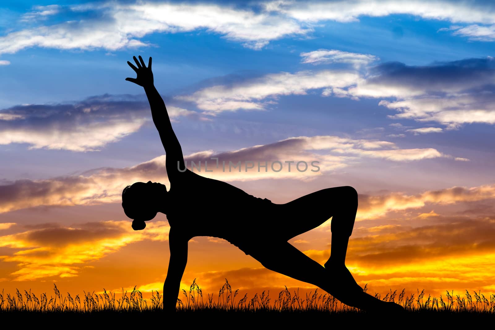 girl doing exercises at sunset by adrenalina