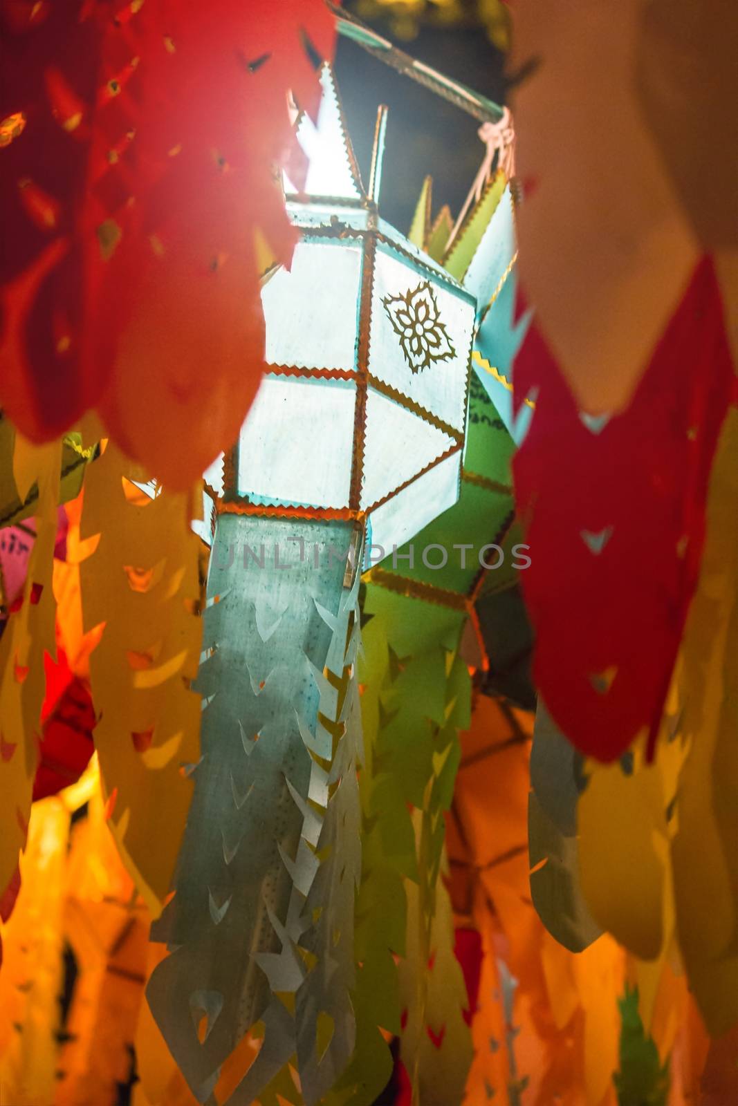close up paper lamp shade on blur bokeh muticolor background, se by rakoptonLPN