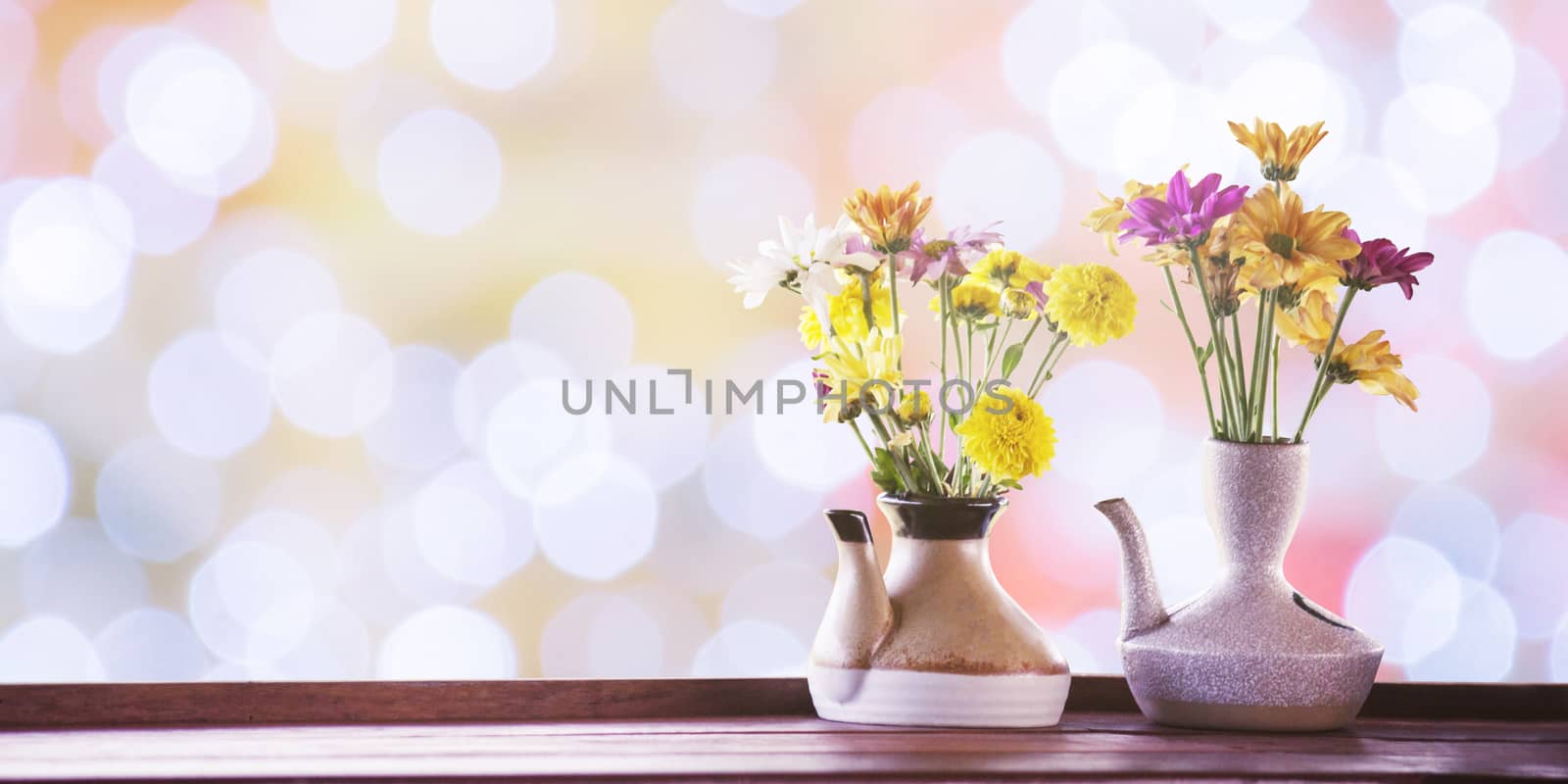 vintage photo of flowers in ceramic potted on bokeh for backgrou by rakoptonLPN