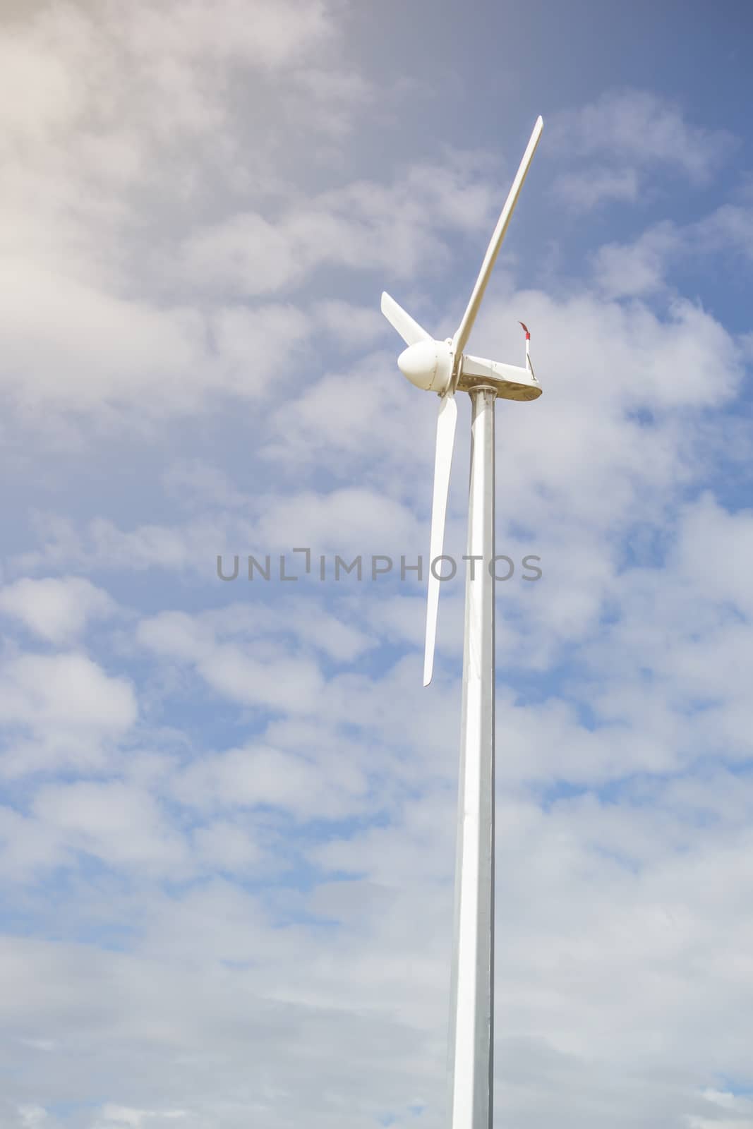 wind turbine for alternative energy on blue sky for background.