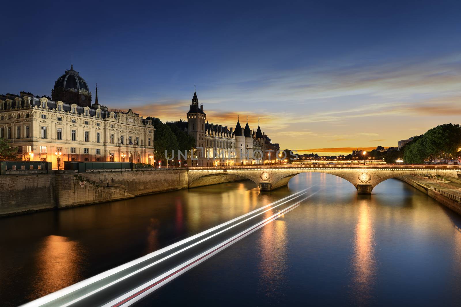 Boat tour on Seine river in Paris with sunset. Paris, France by ventdusud