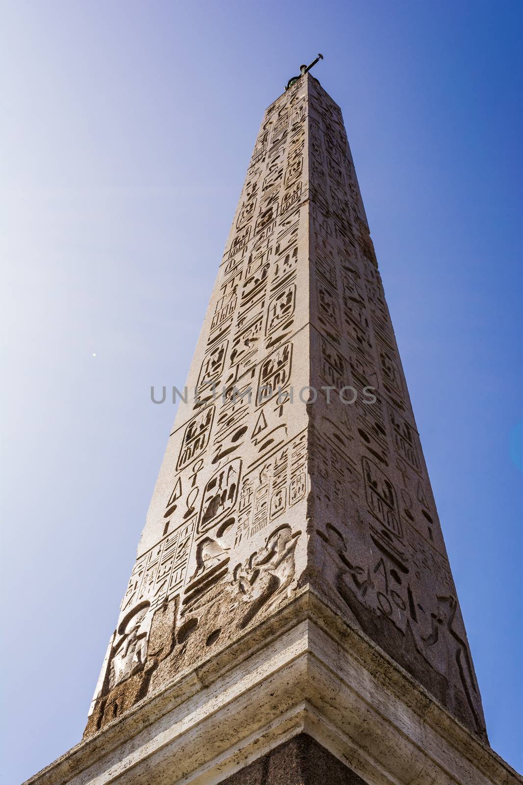 Obelisk in Piazza del Popolo, Rome. An Egyptian obelisk stands in the centre of the Piazza. Three sides of the obelisk were carved during the reign of Sety I and the fourth side, under Rameses II.