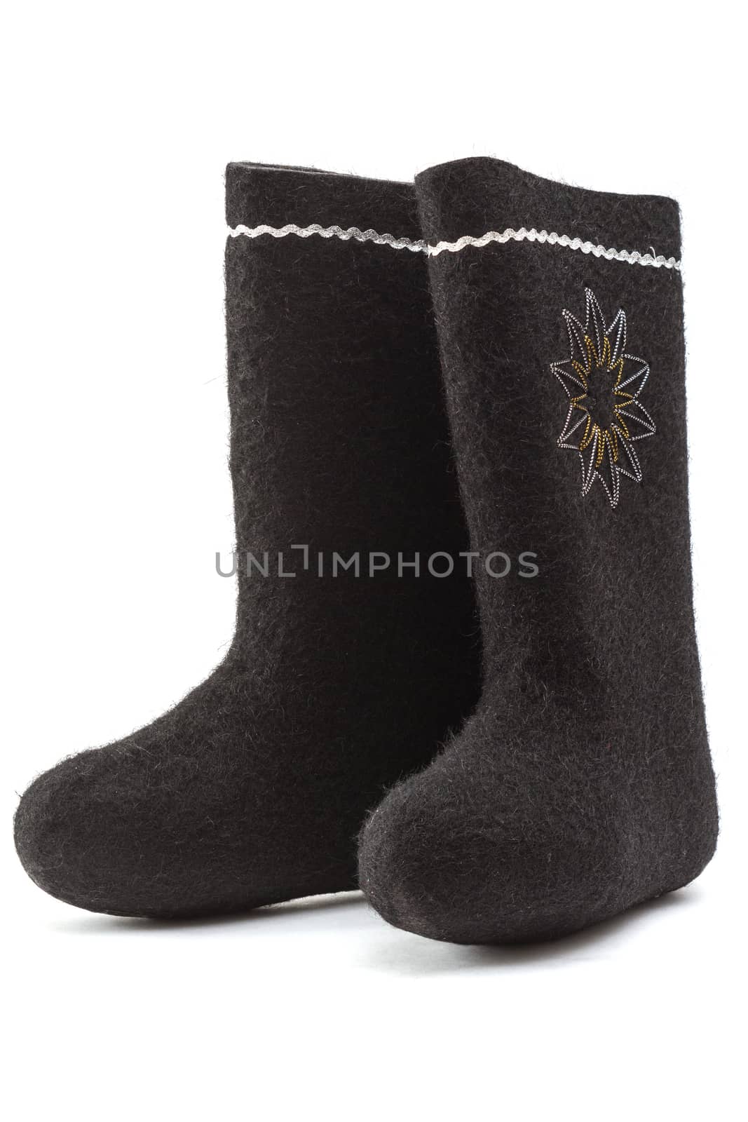 Russian valenki - black felt boots isolated on a white background