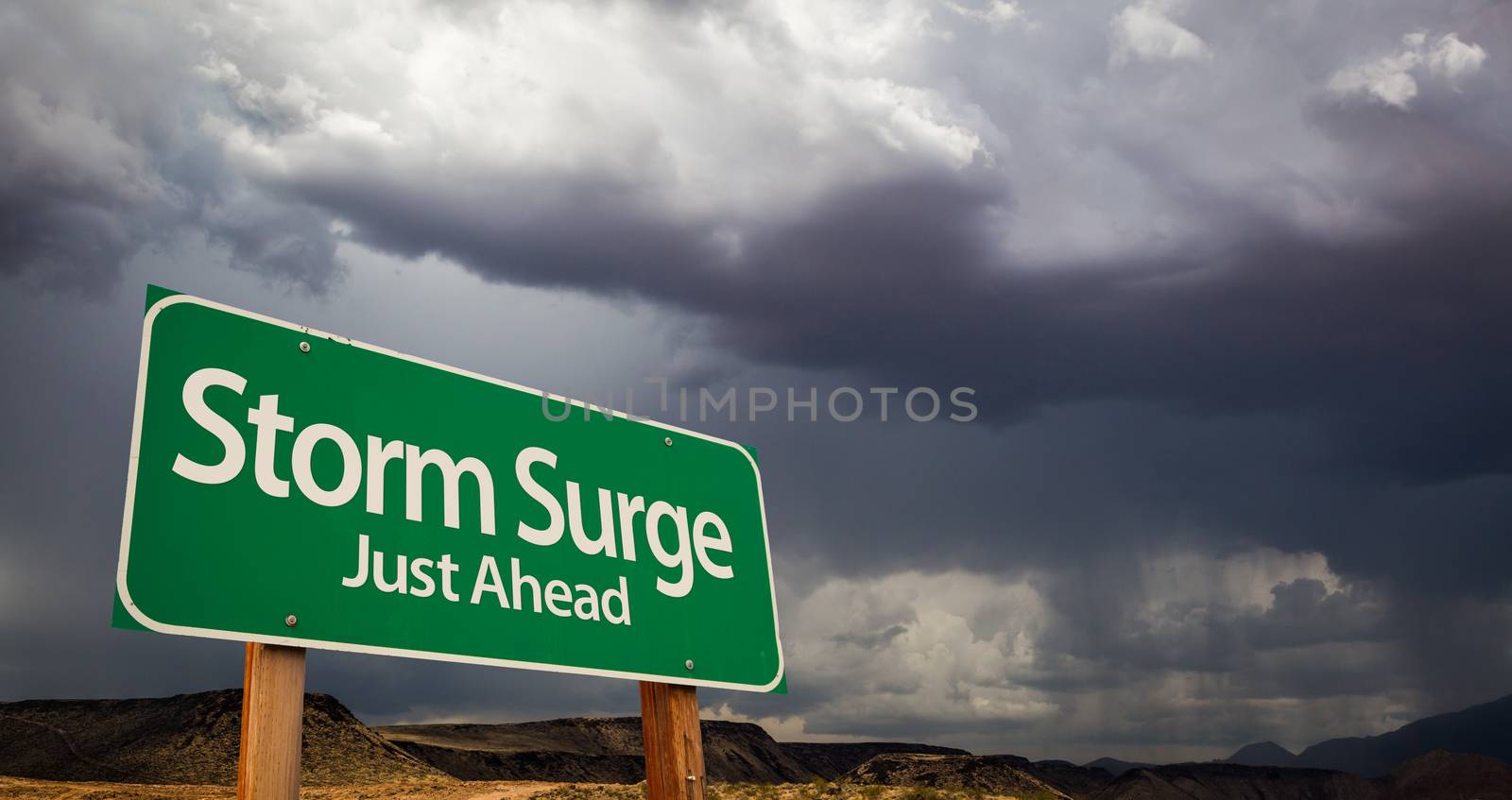 Storm Surge Just Ahead Green Road Sign with Dramatic Clouds and Rain.