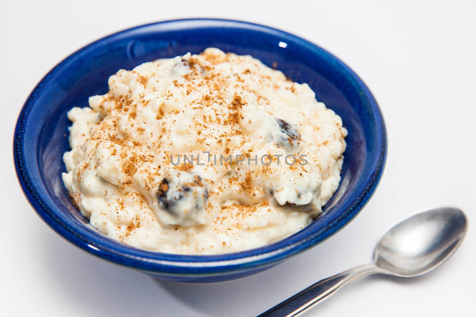 Rice Pudding with cinnamon and raisins preparation : Ready served sweet rice pudding