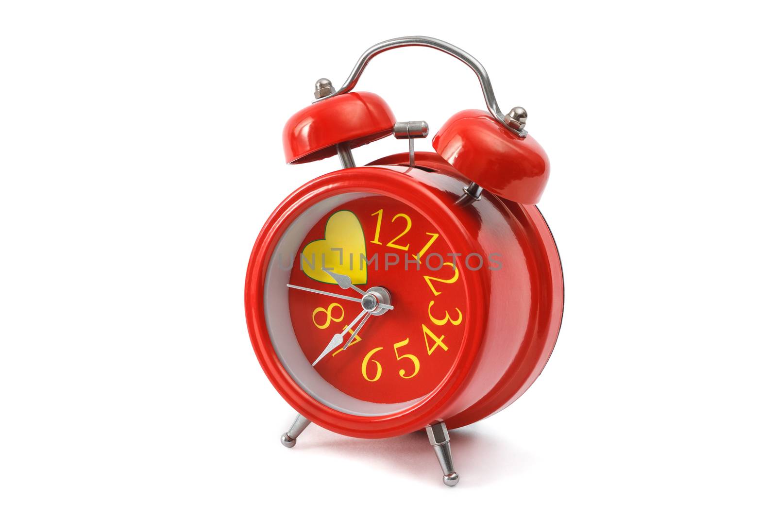 red alarm clock closeup isolated on a white background