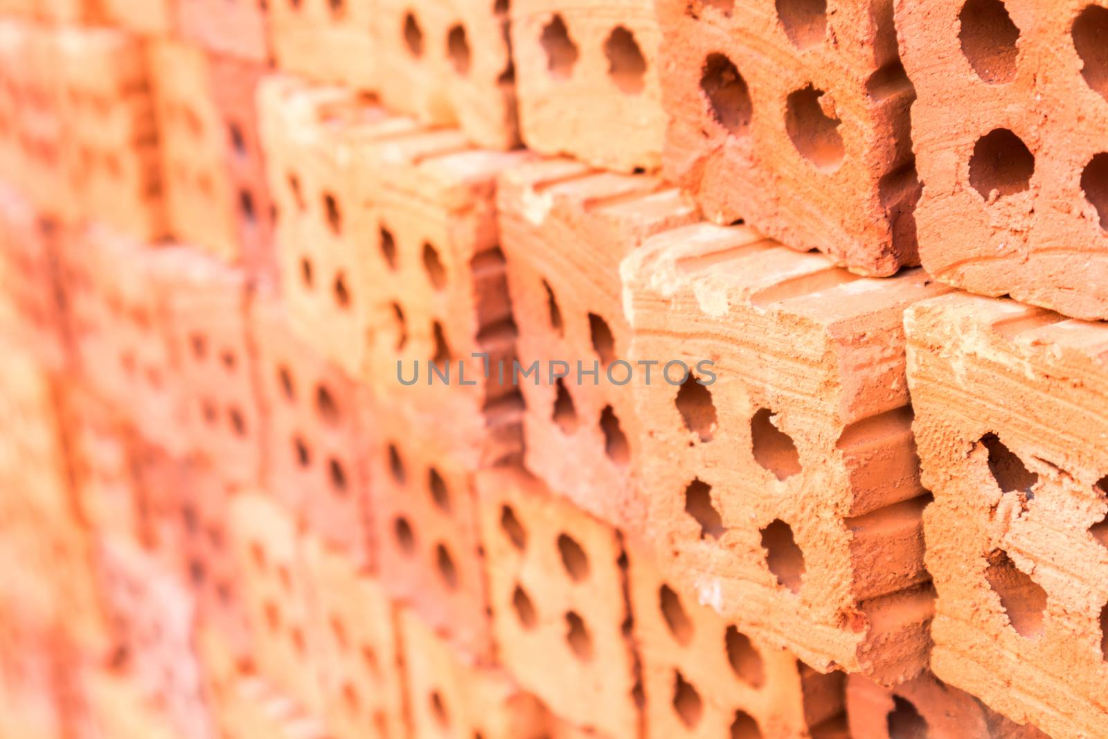 Closeup Group of blend red brick material for industry , selective focus