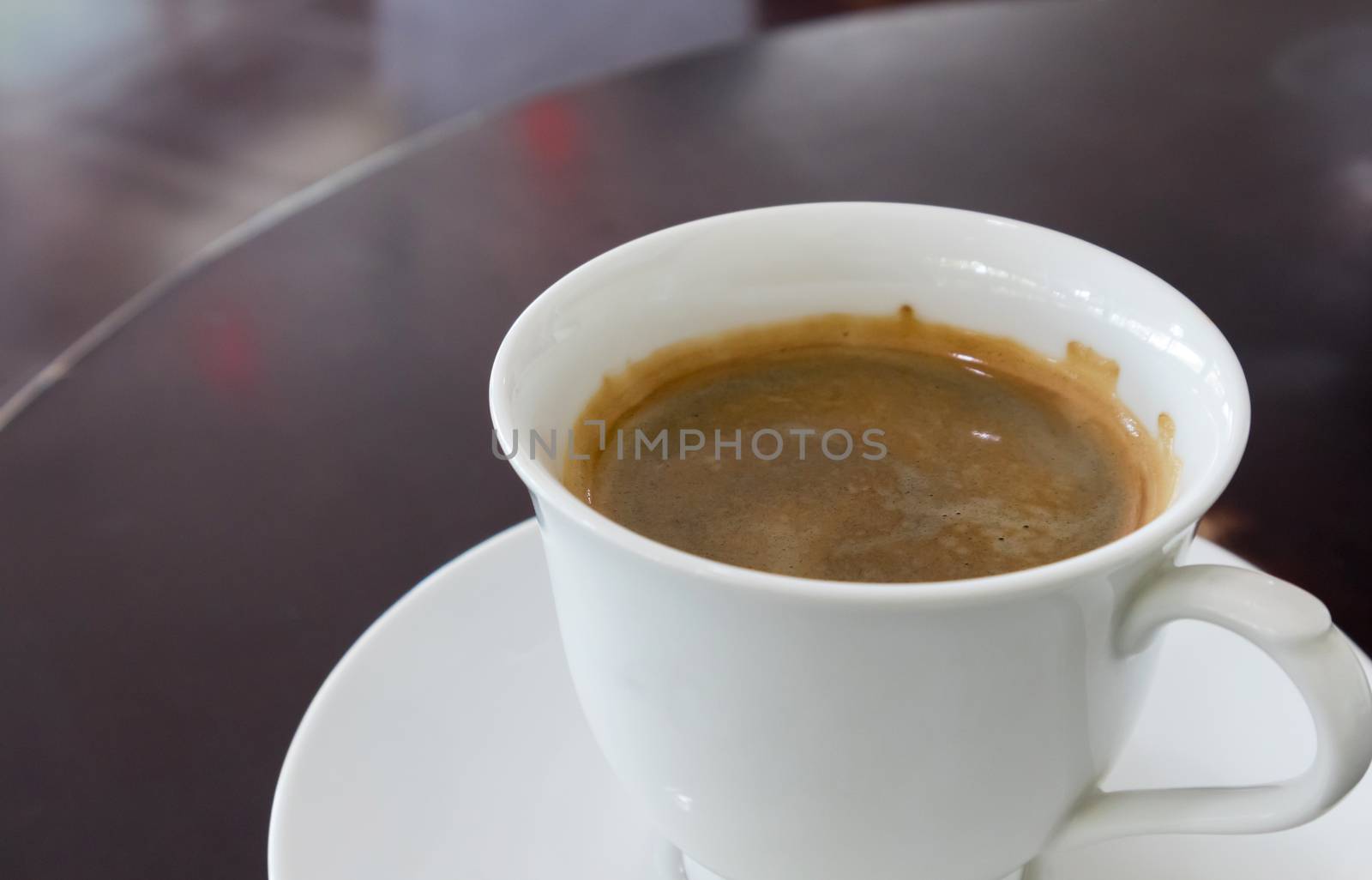 Cup of hot americano coffee on wood table in bakery shop by pt.pongsak@gmail.com