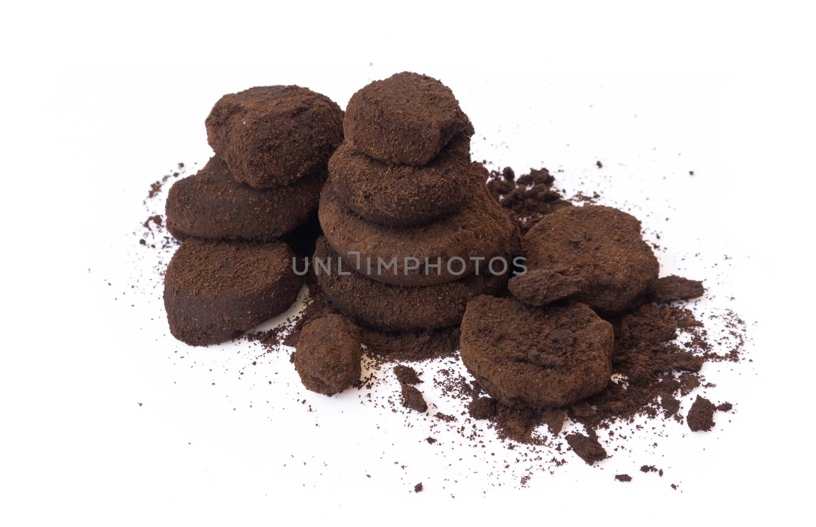 Closeup coffee grounds on white background by pt.pongsak@gmail.com