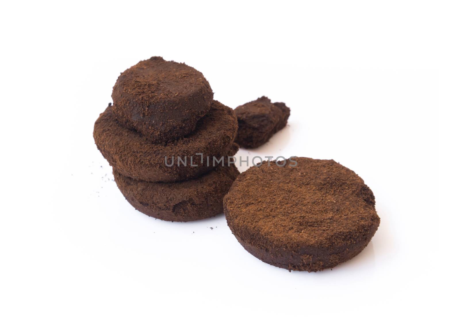 Closeup coffee grounds on white background by pt.pongsak@gmail.com