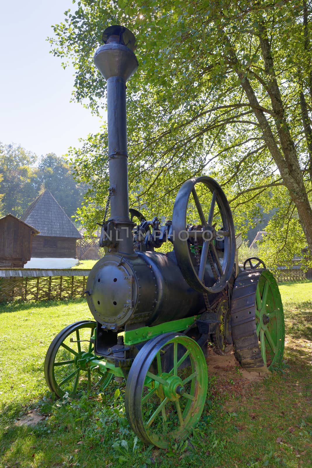 Old fashionned  thresher in small village