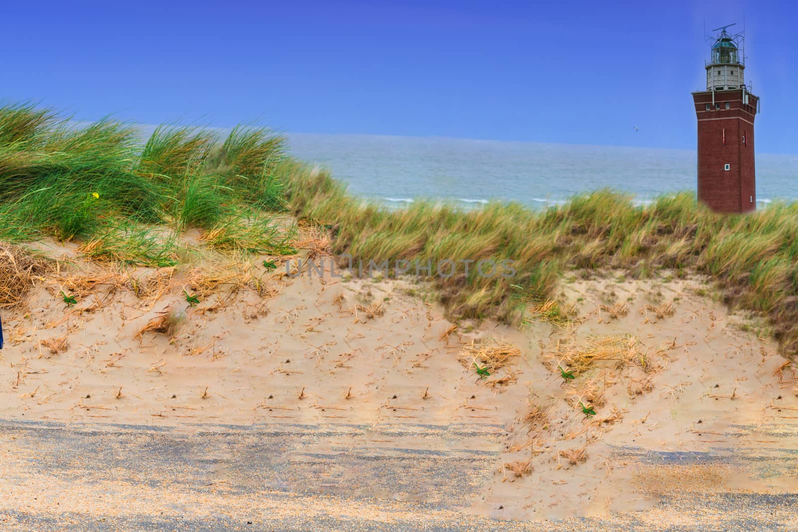 Quadrangular Lighthouse in the sand dunes at Vuurtoren Westhoofd near the city Outdorp in Zuid-Holland.