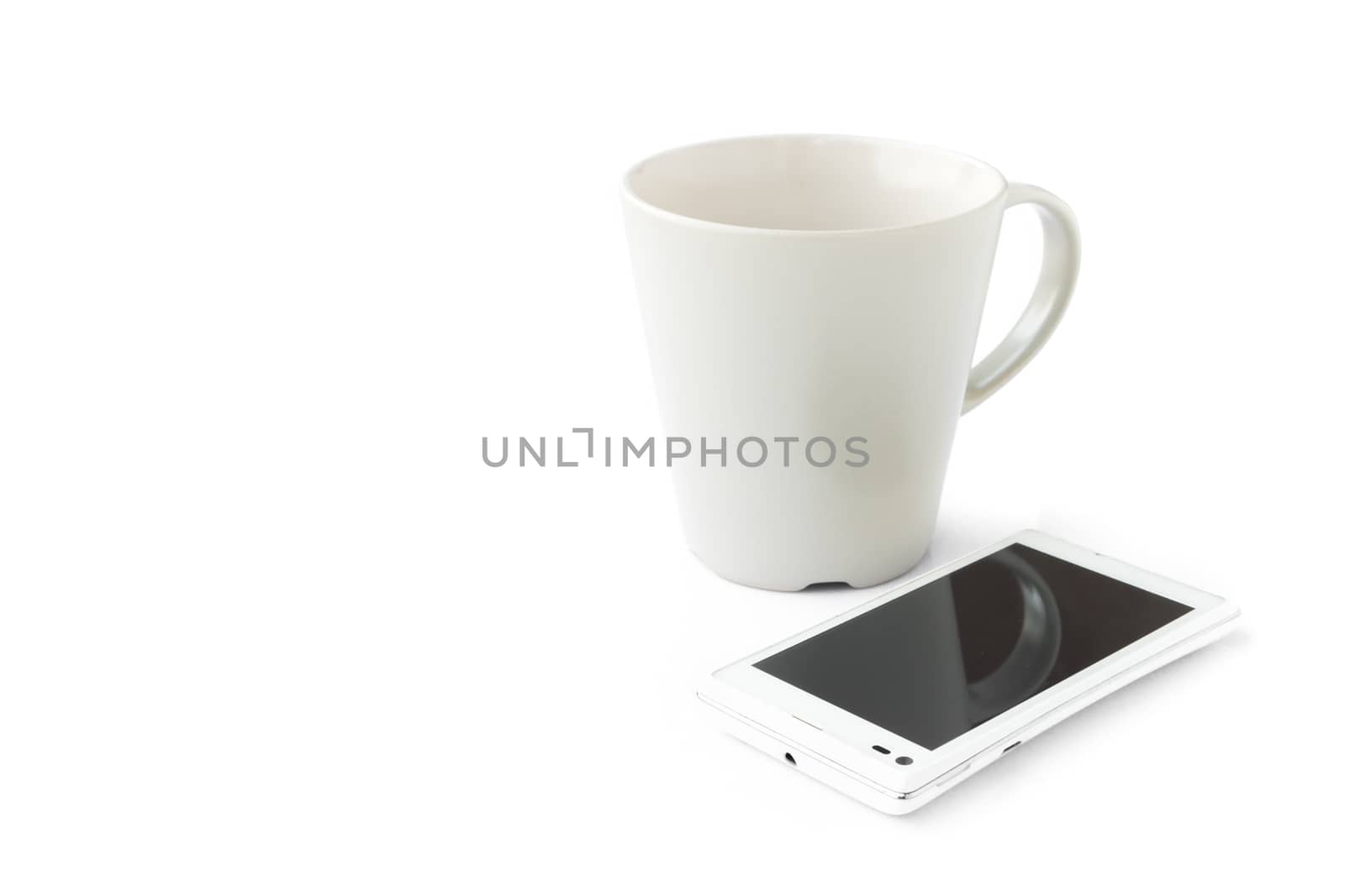 Smart phone and empty mug on white background, Morning breakfast and technology concept