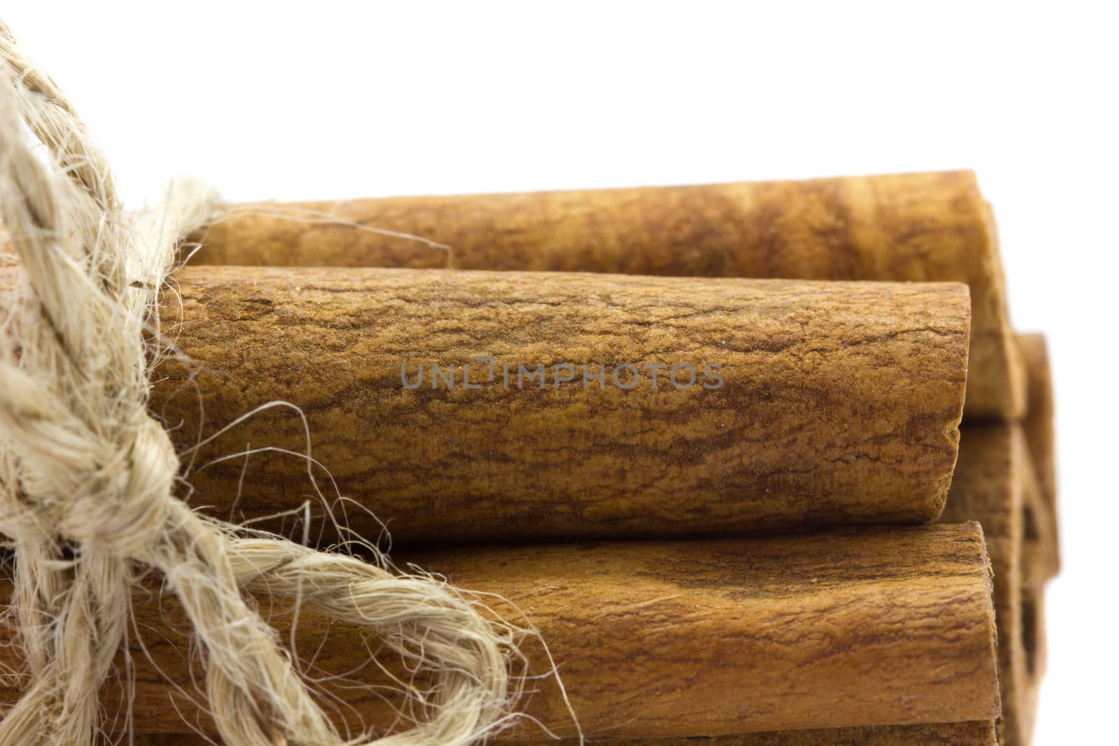 Whole bunch of cinnamon on a white background.