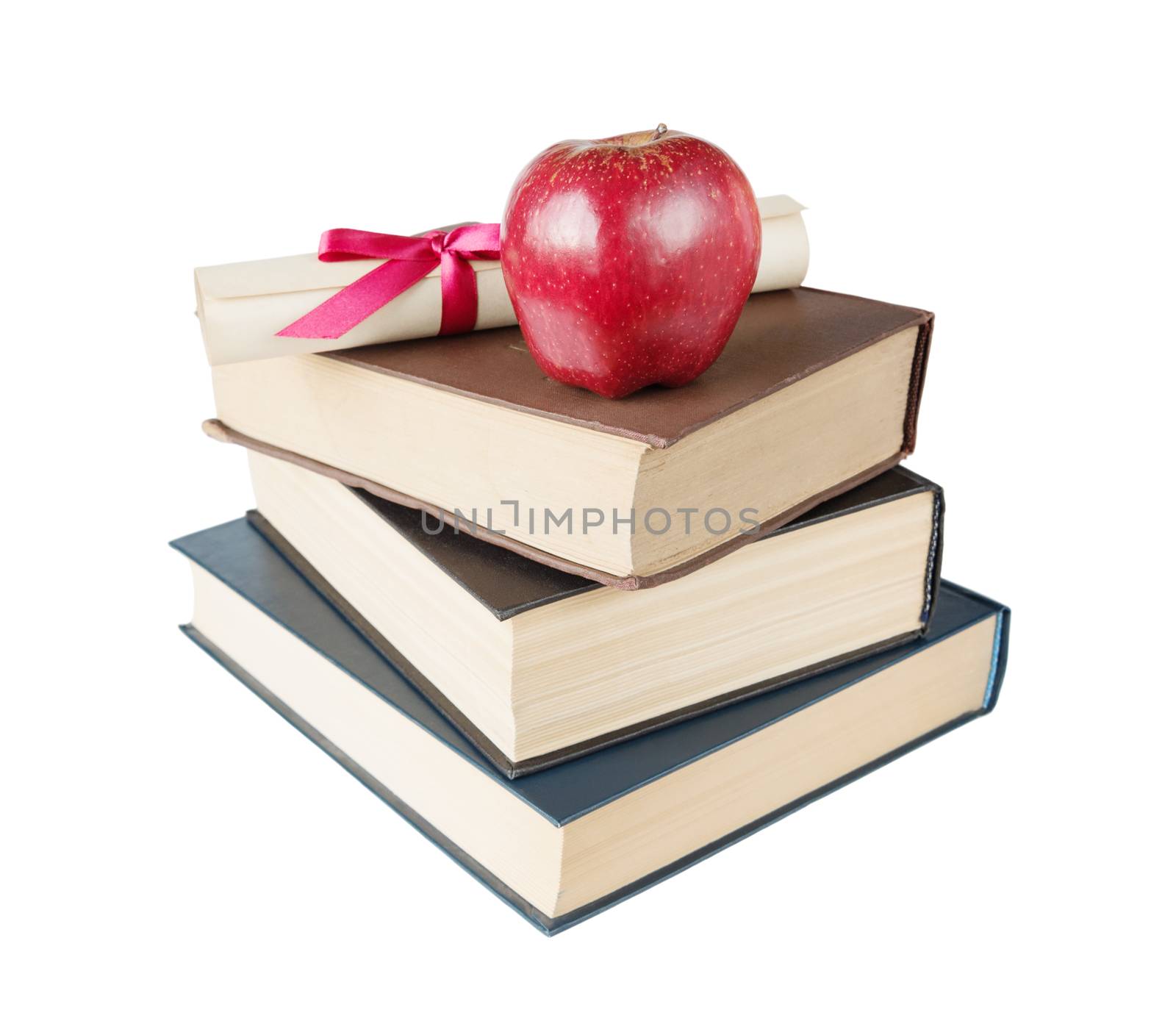 Concept of education: stack of big books, red apple and paper scroll tied with red ribbon with a bow, isolated on white background