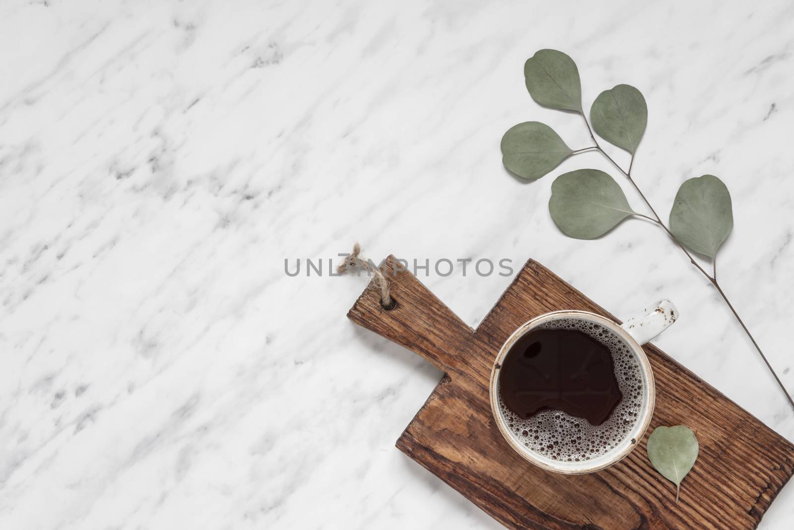 Cup of coffee on a marble surface with copy-space by Epitavi