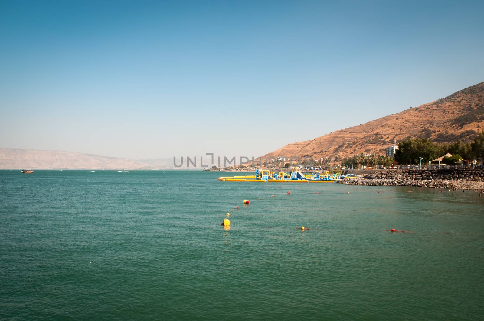 Lake of the sea of Galilee and the beach. Israel . by LarisaP