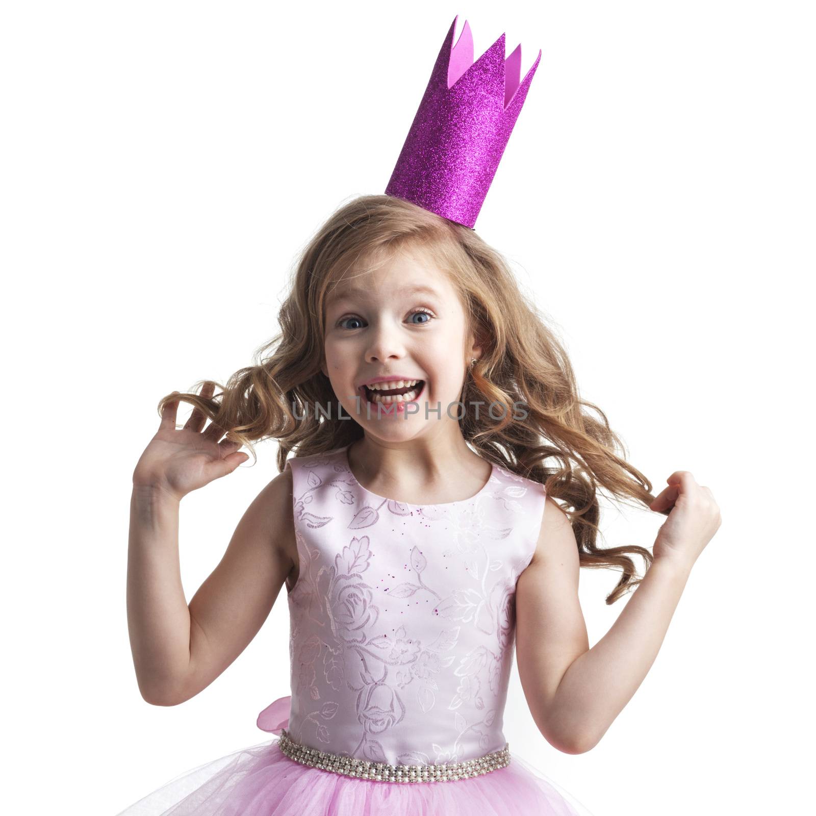 Happy small princess girl in pink dress and crown isolated on white background