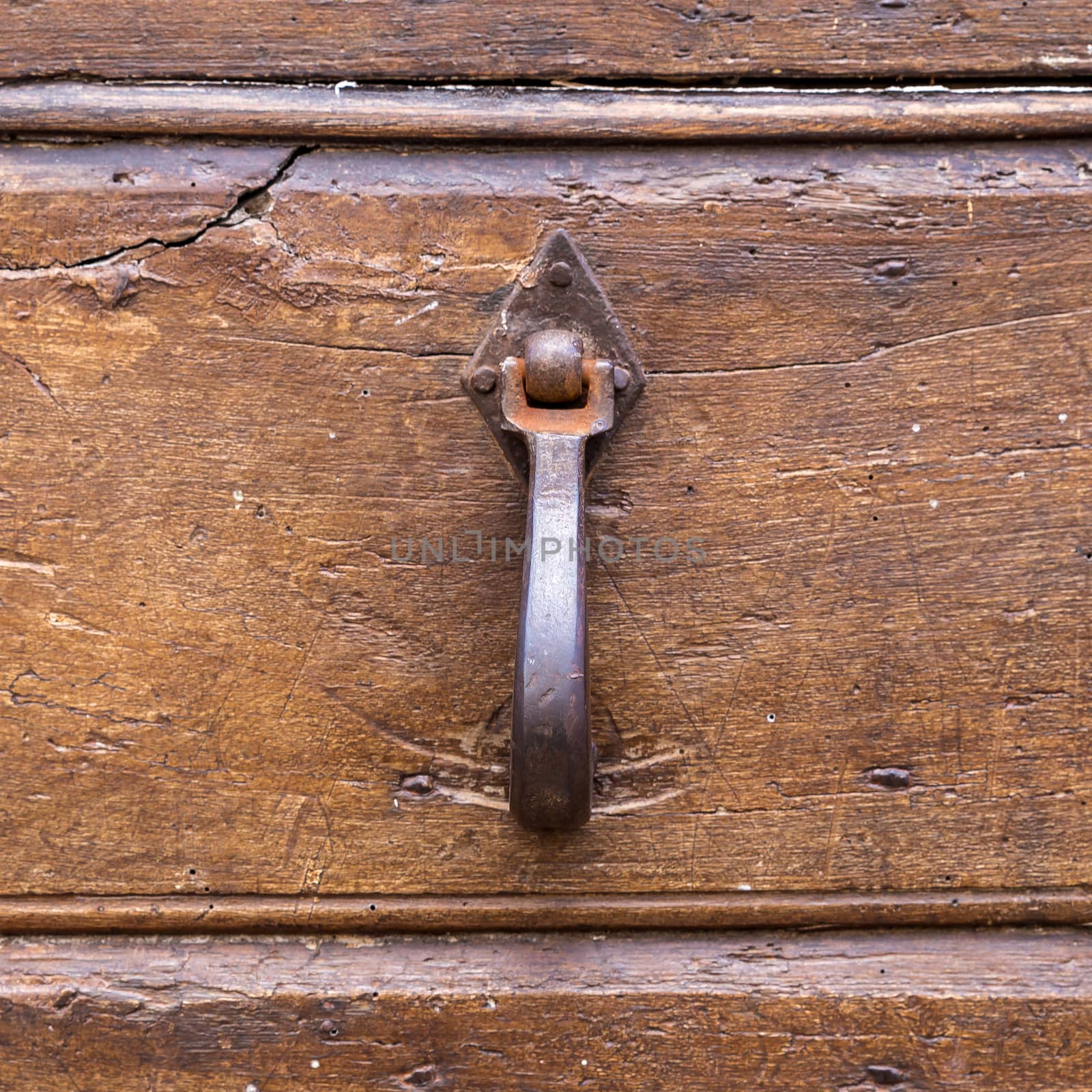 Close up of rustic old door in Assisi, Italy.