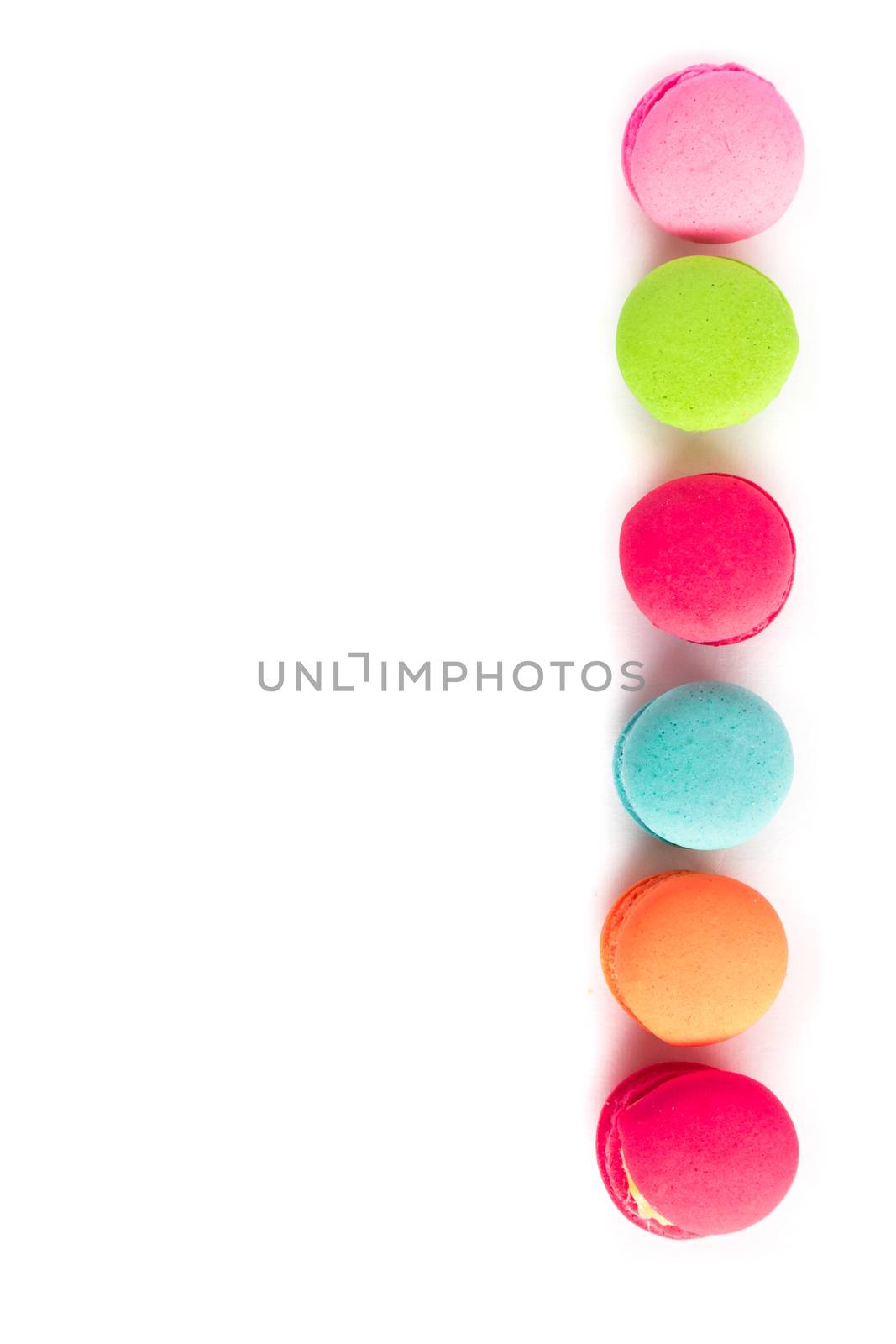 Top view French macarons colorful on white background, sweet and dessert menu