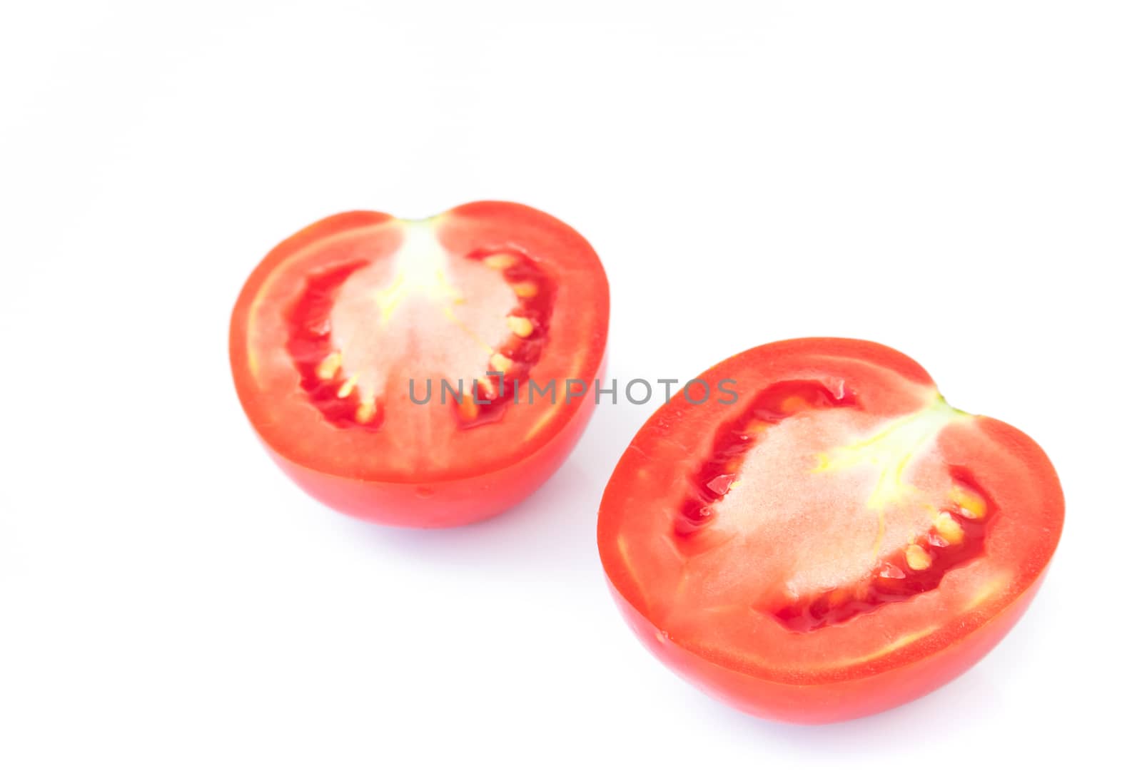 Closeup fresh red tomatoes slice on white background, food and vegetable