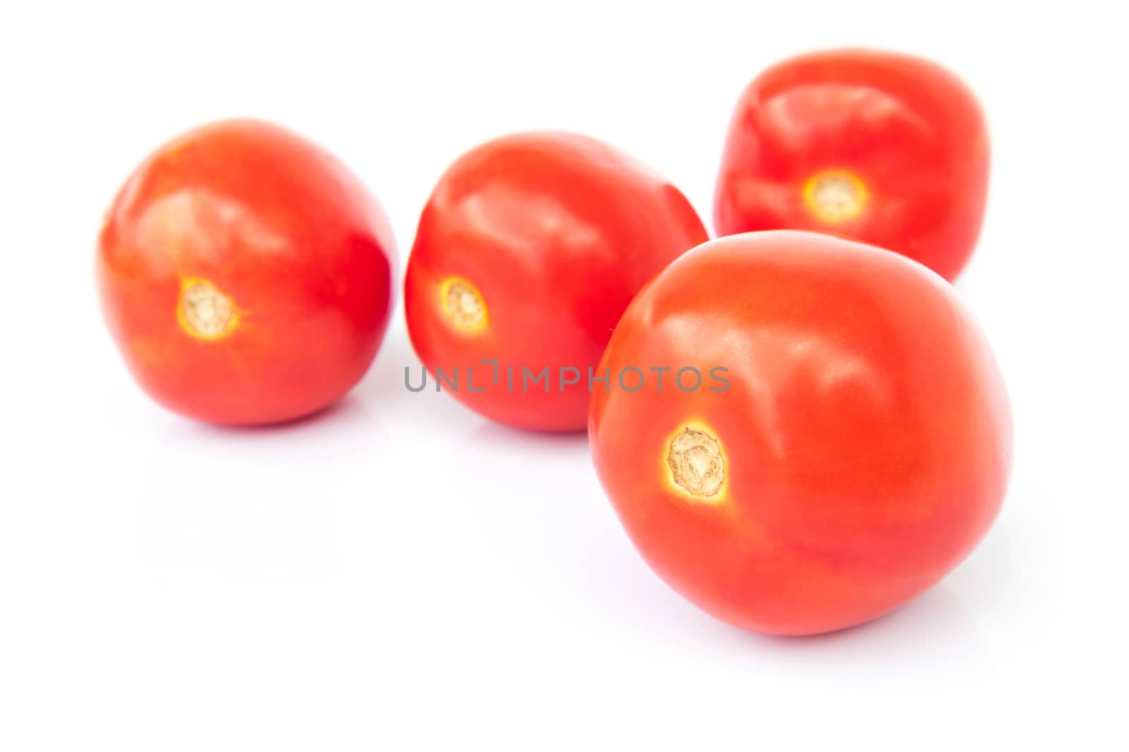 Closeup fresh red tomatoes on white background, food and vegetable concept