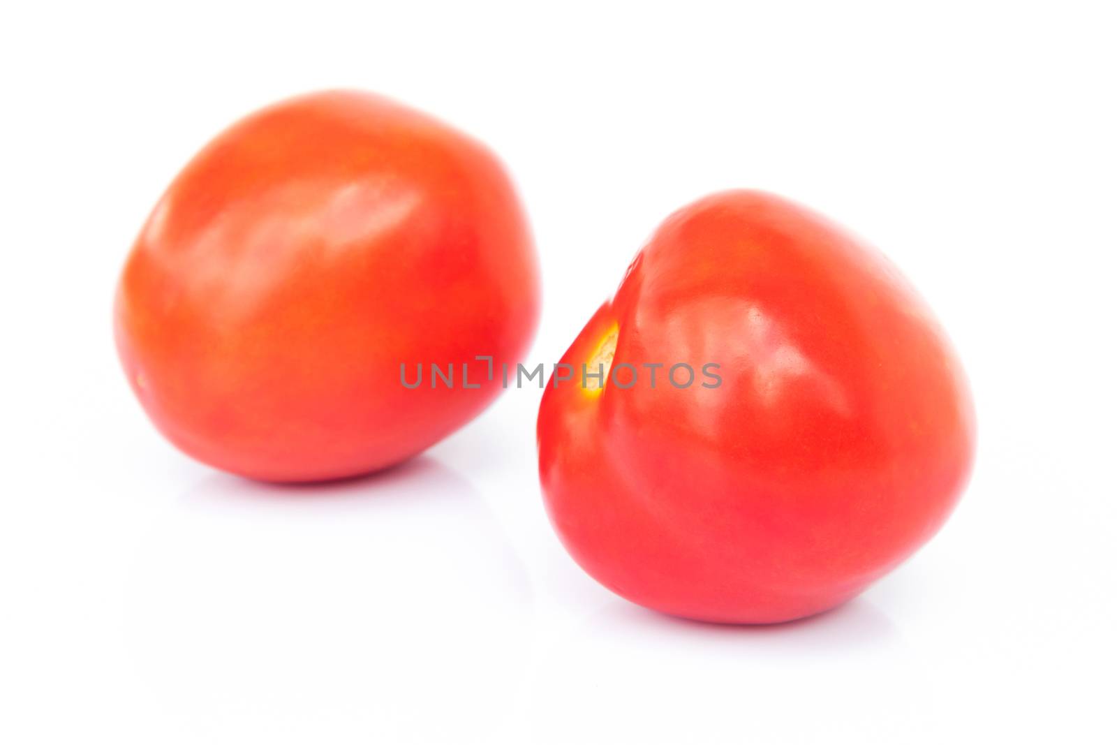 Closeup fresh red tomatoes on white background, food and vegetable concept