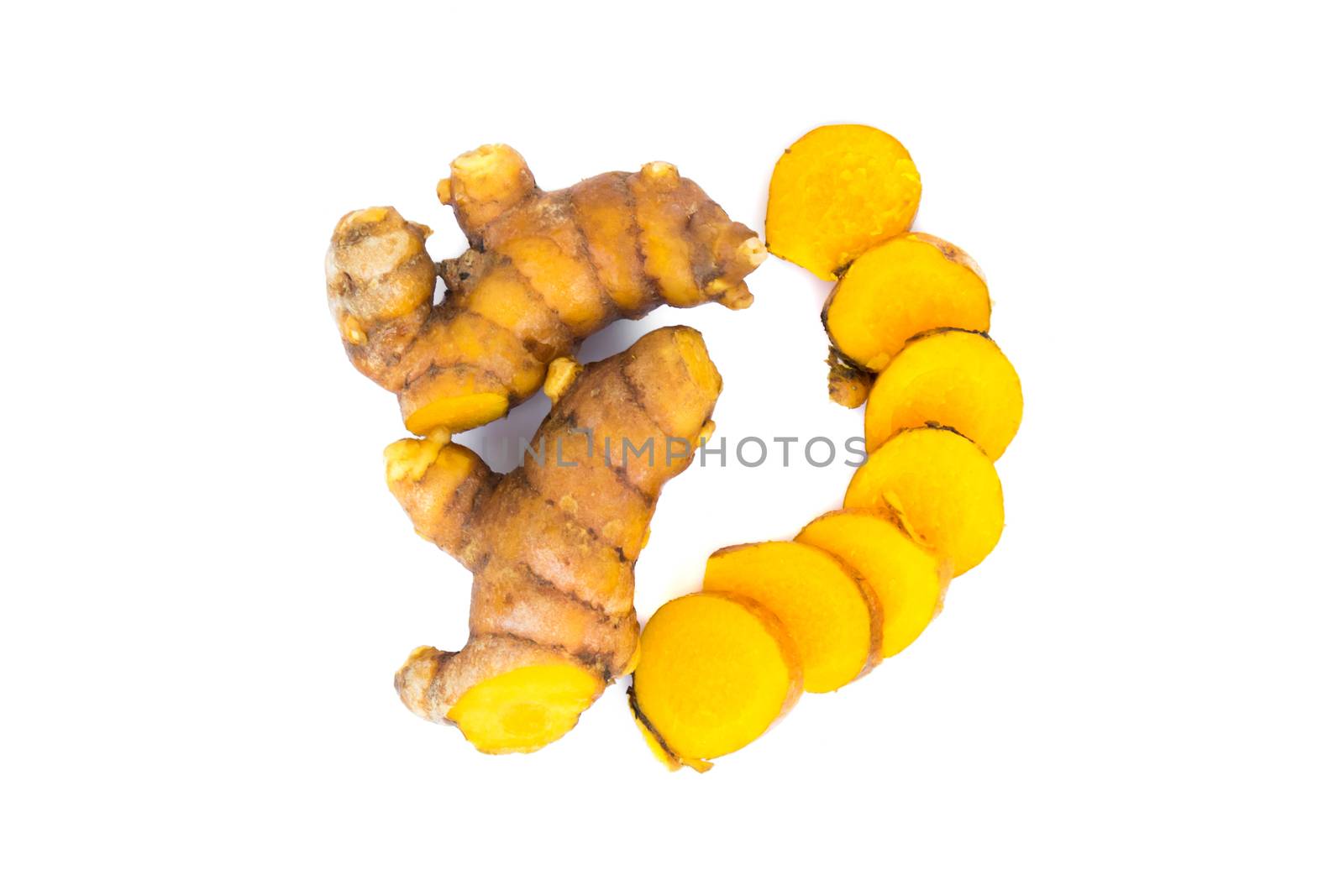 Closeup turmeric roots slices on white background