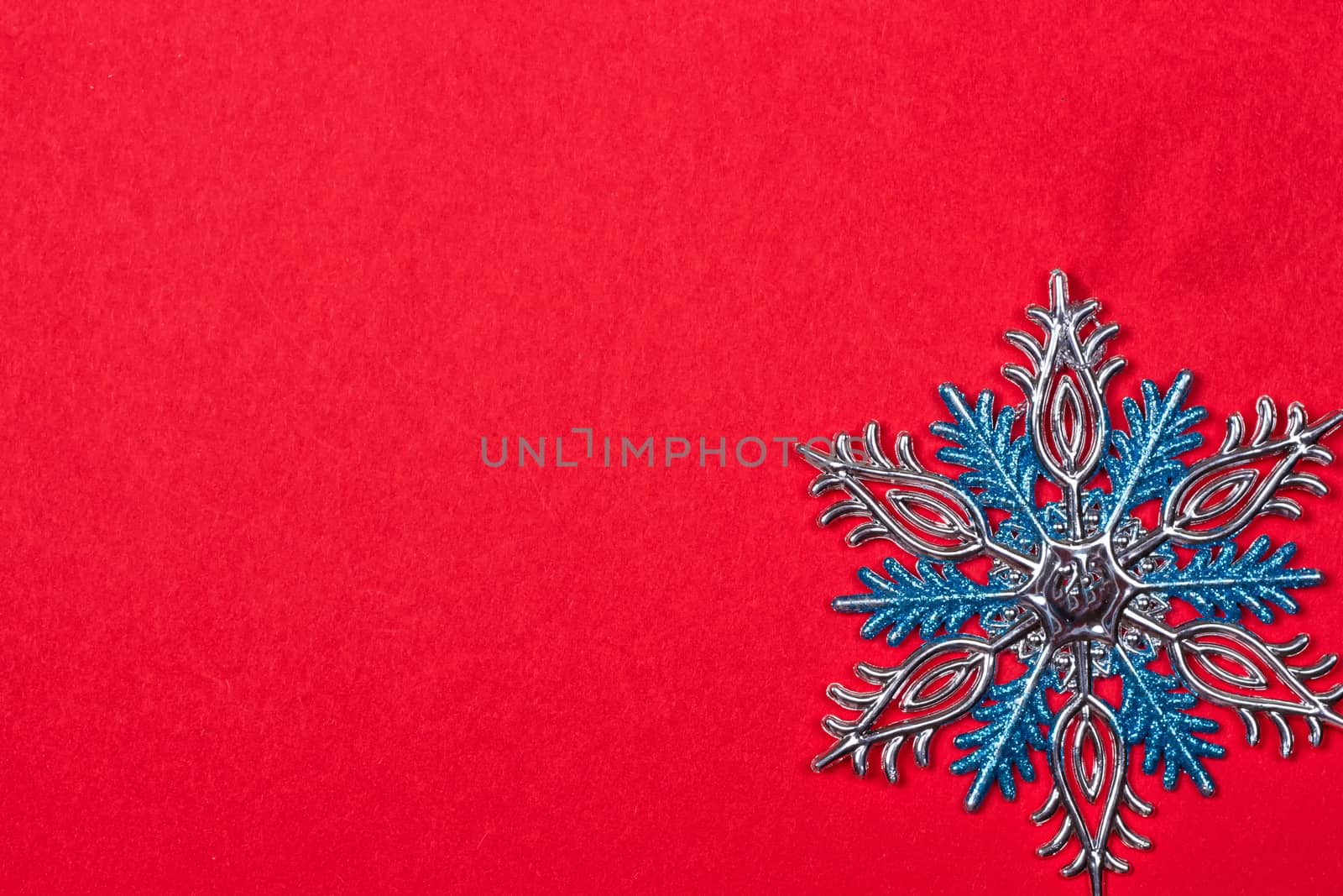 Christmas background with Christmas toys as background. snowflakes on a red background