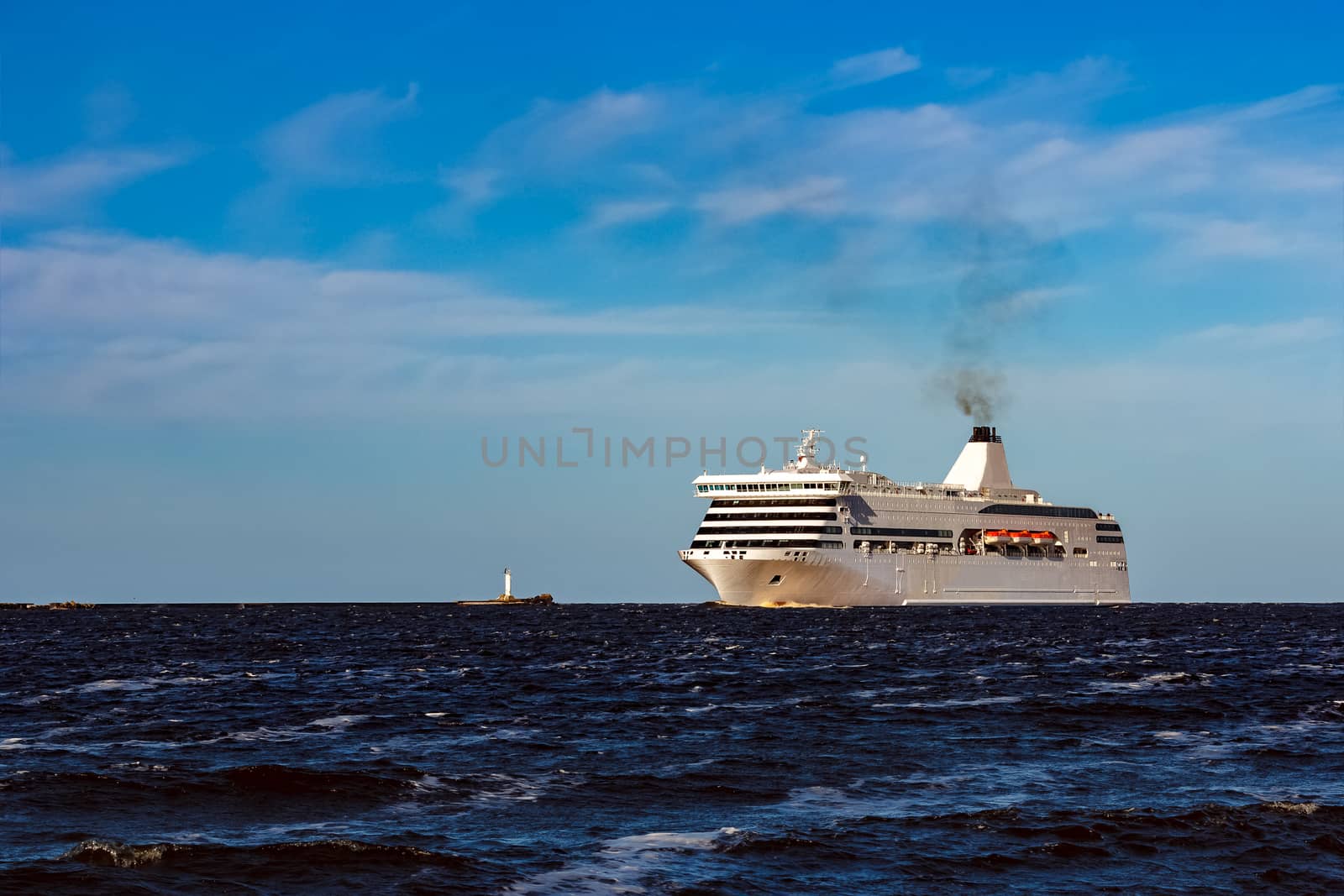 White cruise liner sailing on a clear day