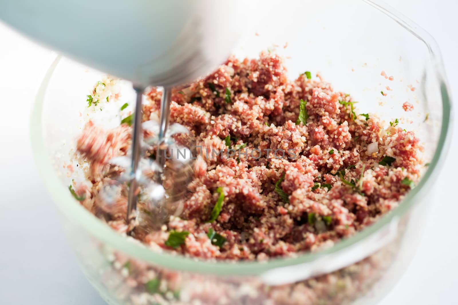 Step by step Levantine cuisine kibbeh preparation : Mixing the ingredients to prepare kibbeh into a bowl