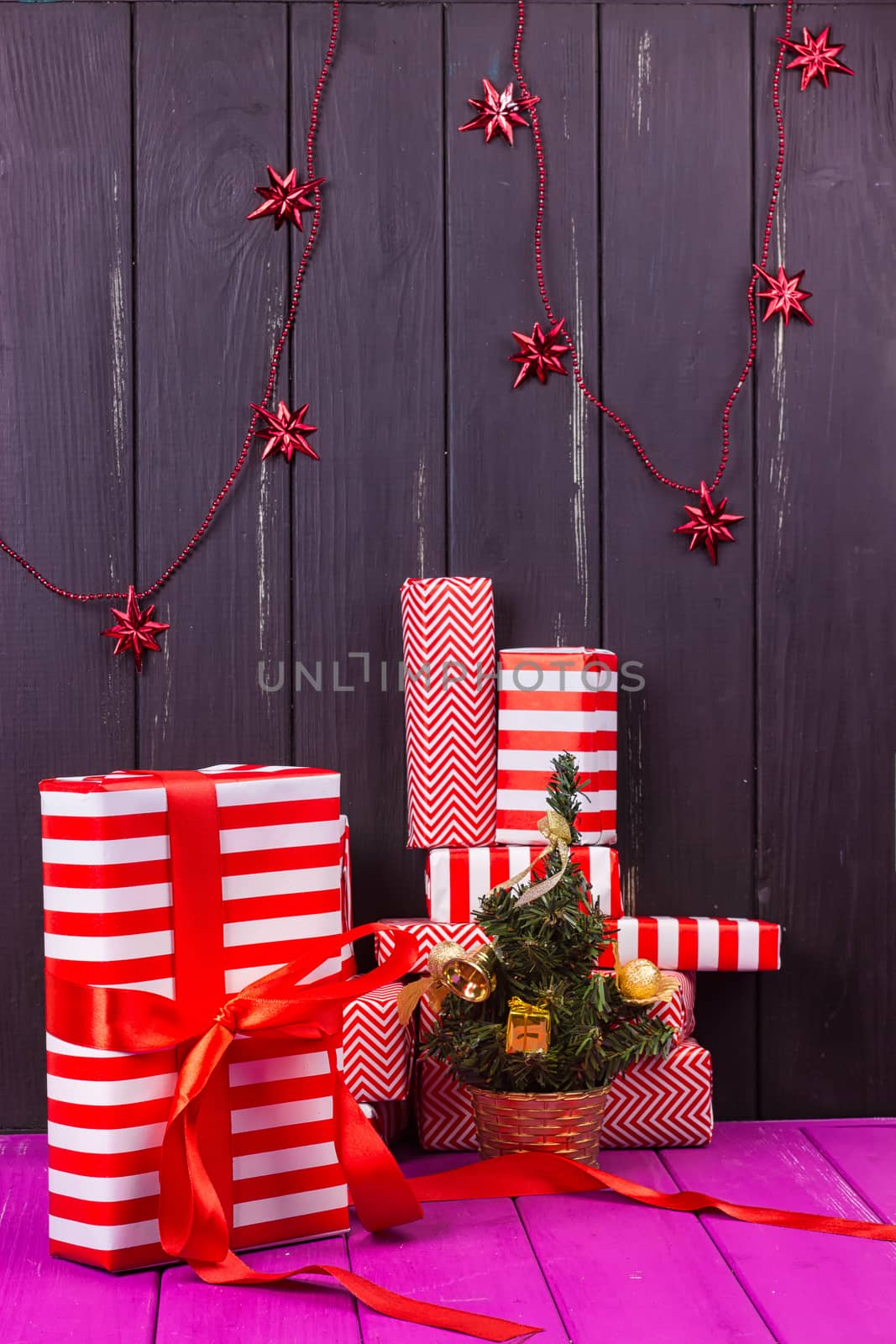 Gift boxes and small decorated Christmas tree by victosha