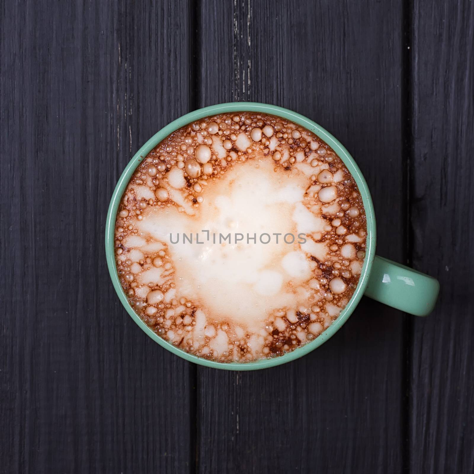 Hot chocolate with marshmallows on grunge dark table