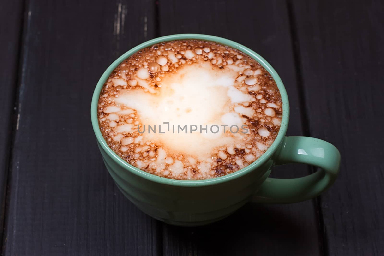 Hot chocolate with marshmallows on grunge dark table