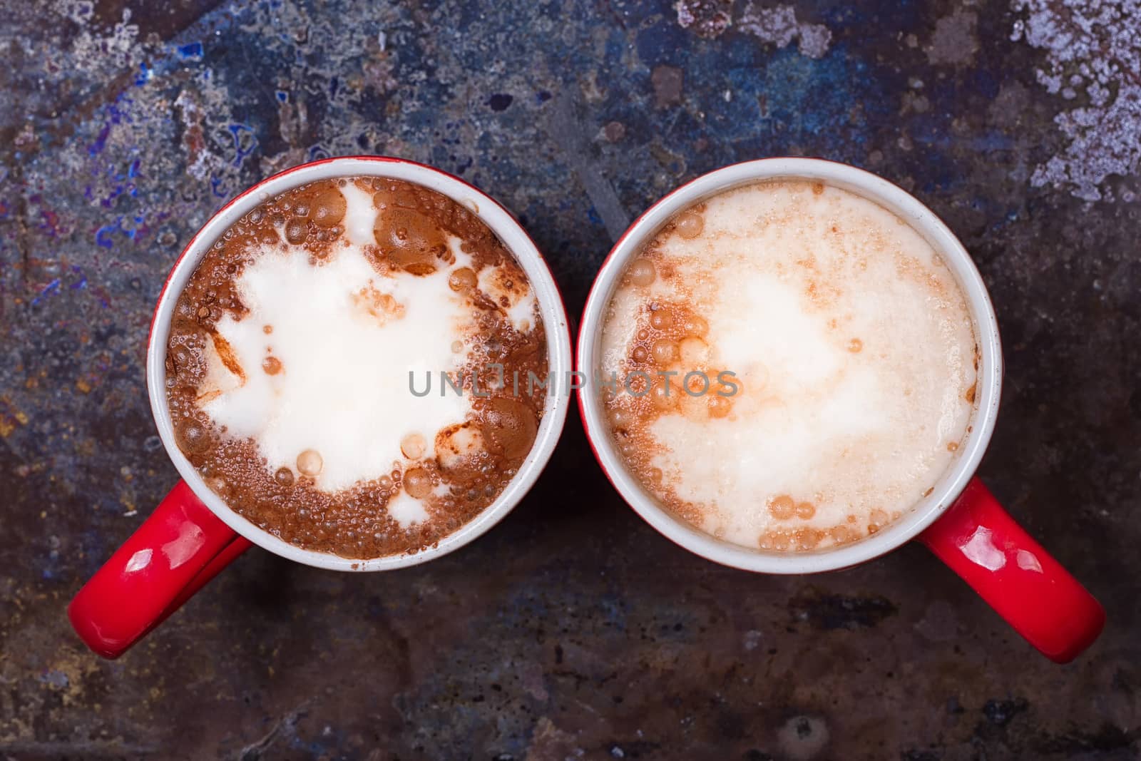 Two coffee cups for lovers prepare for morning coffee with copy blank space for writing on rustic grunge background