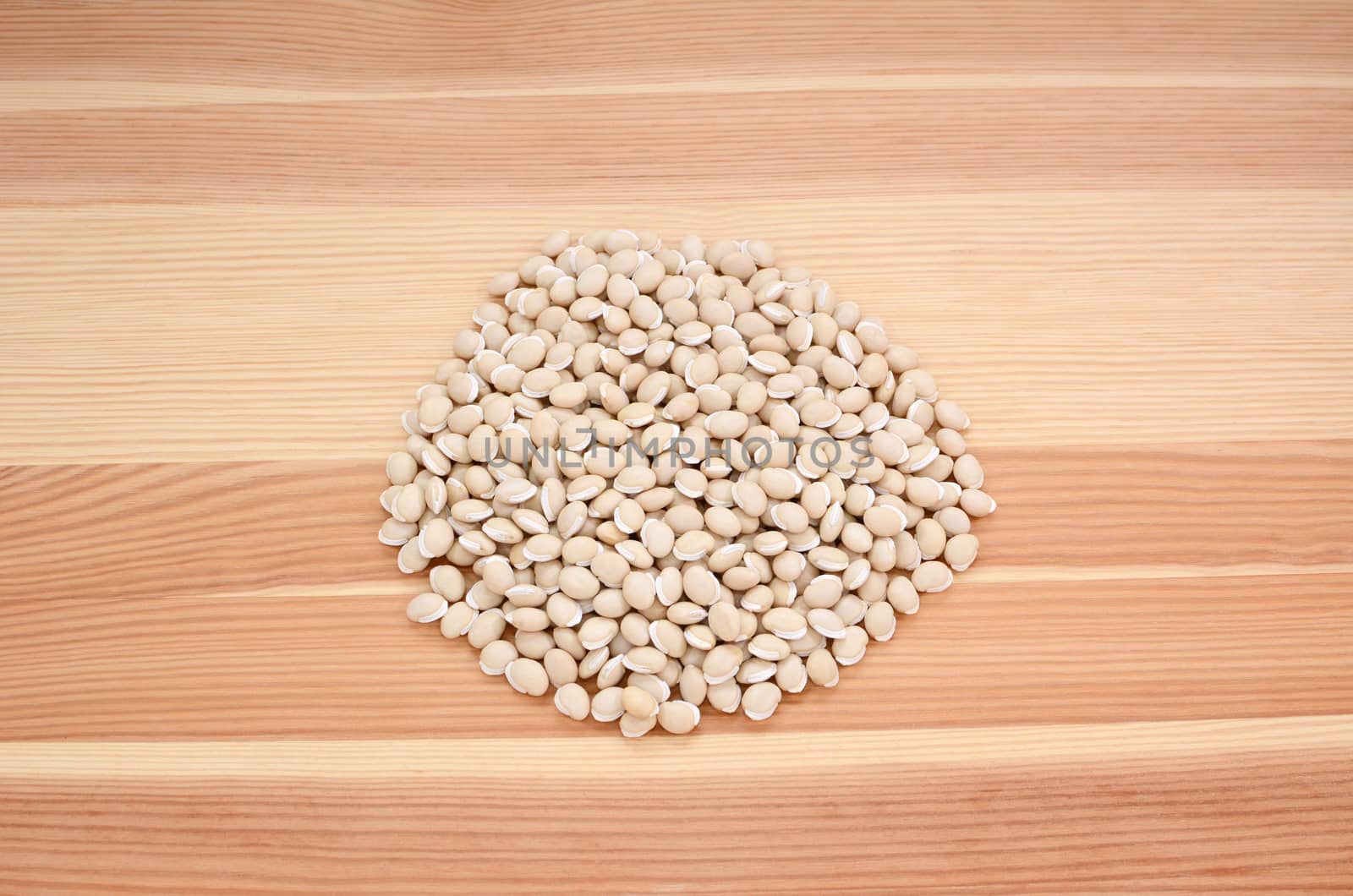 Neavy beans on a wooden background, pine wood grain