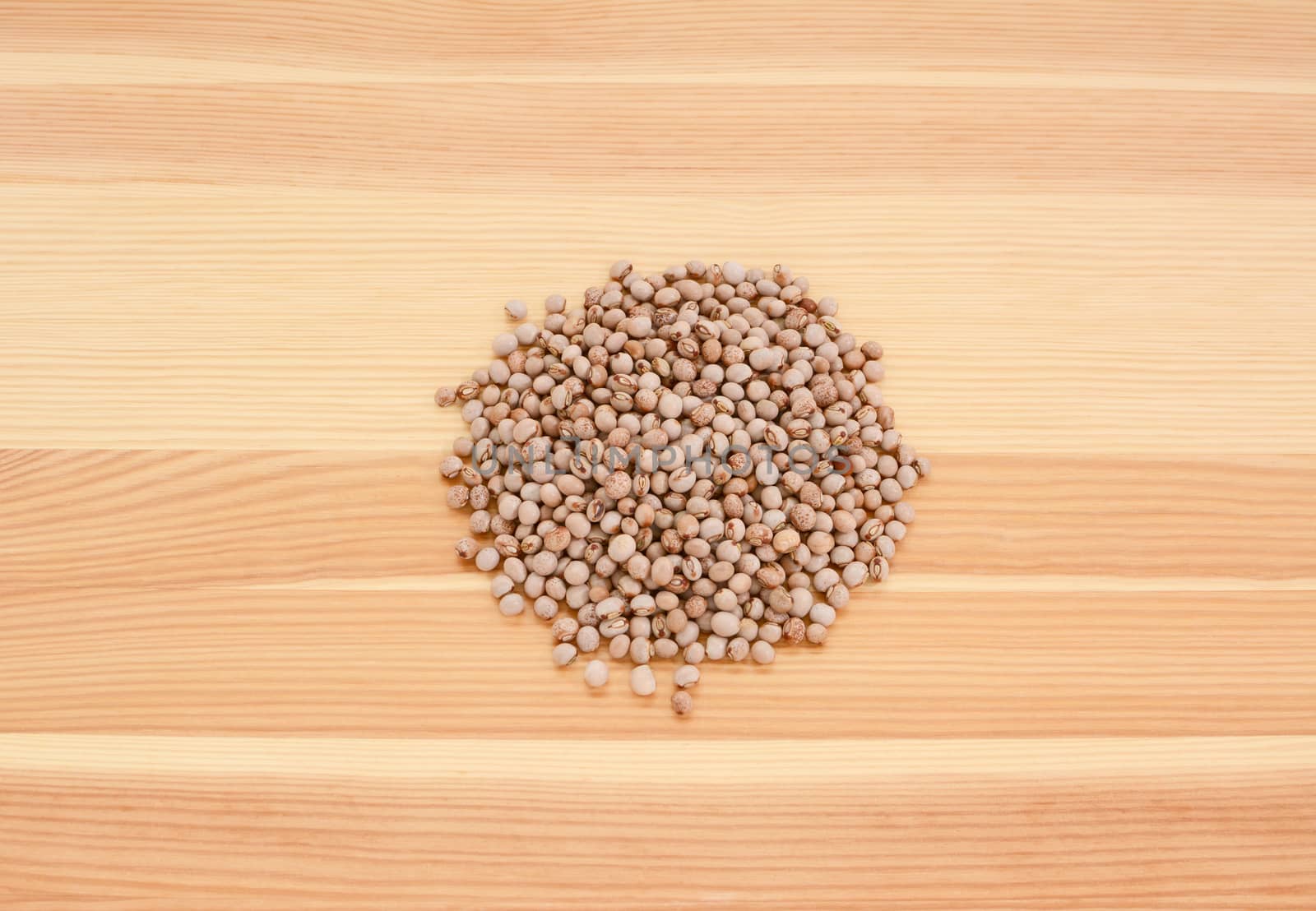 Pigeon peas on a wooden background, pine wood grain
