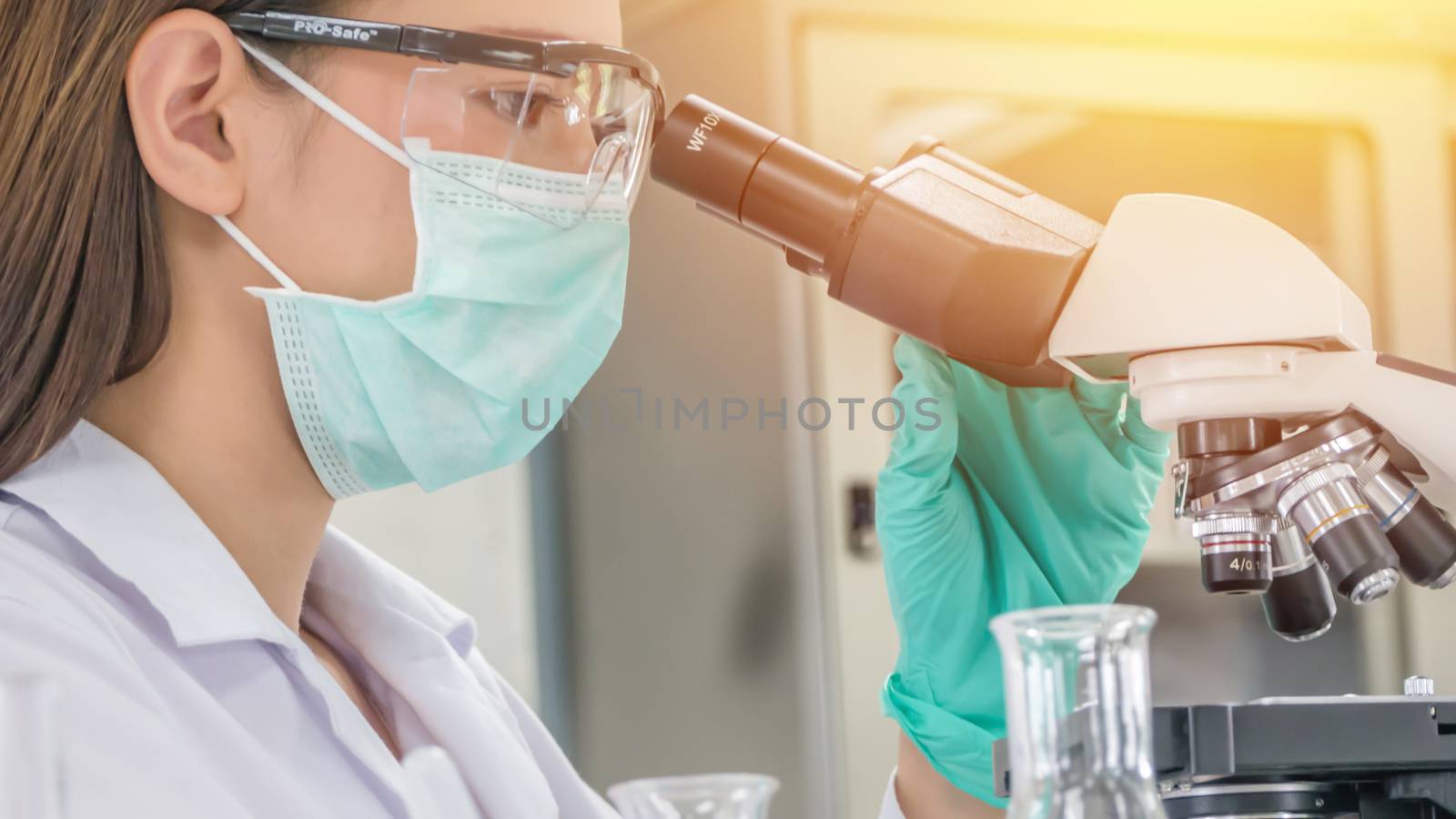 Scientist working at laboratory by rakratchada