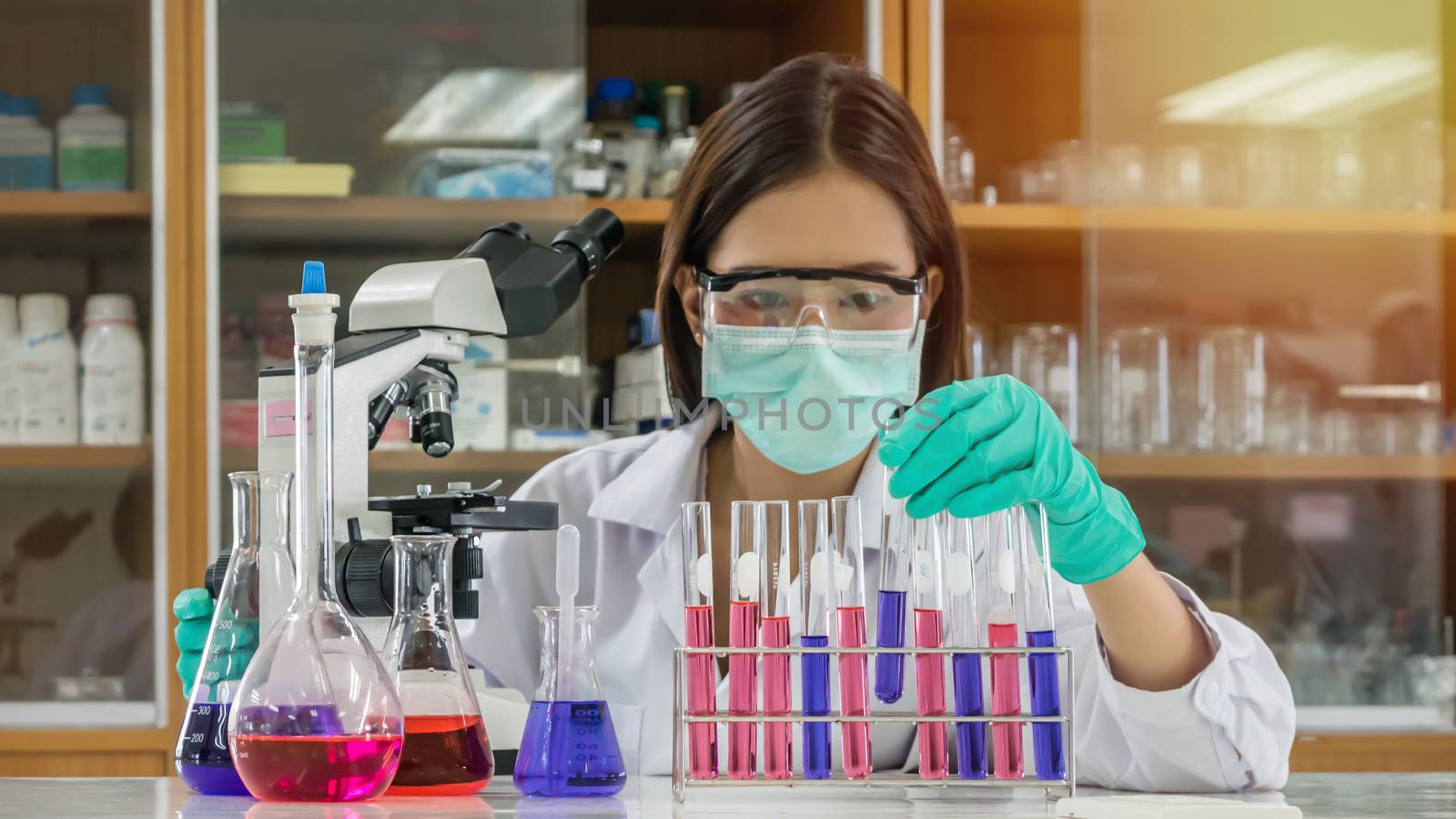 Portrait of Asian scientific researcher working in laboratory