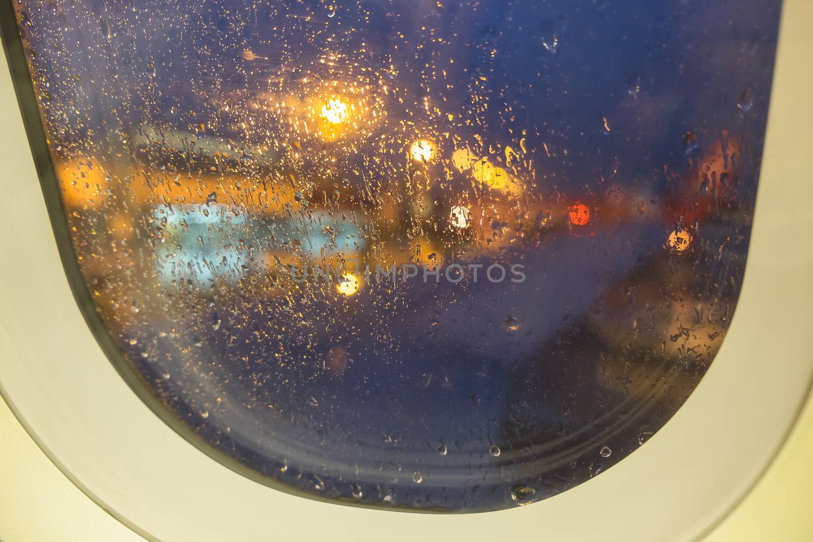 defocused view on airplane wing through passenger window by luckyfim