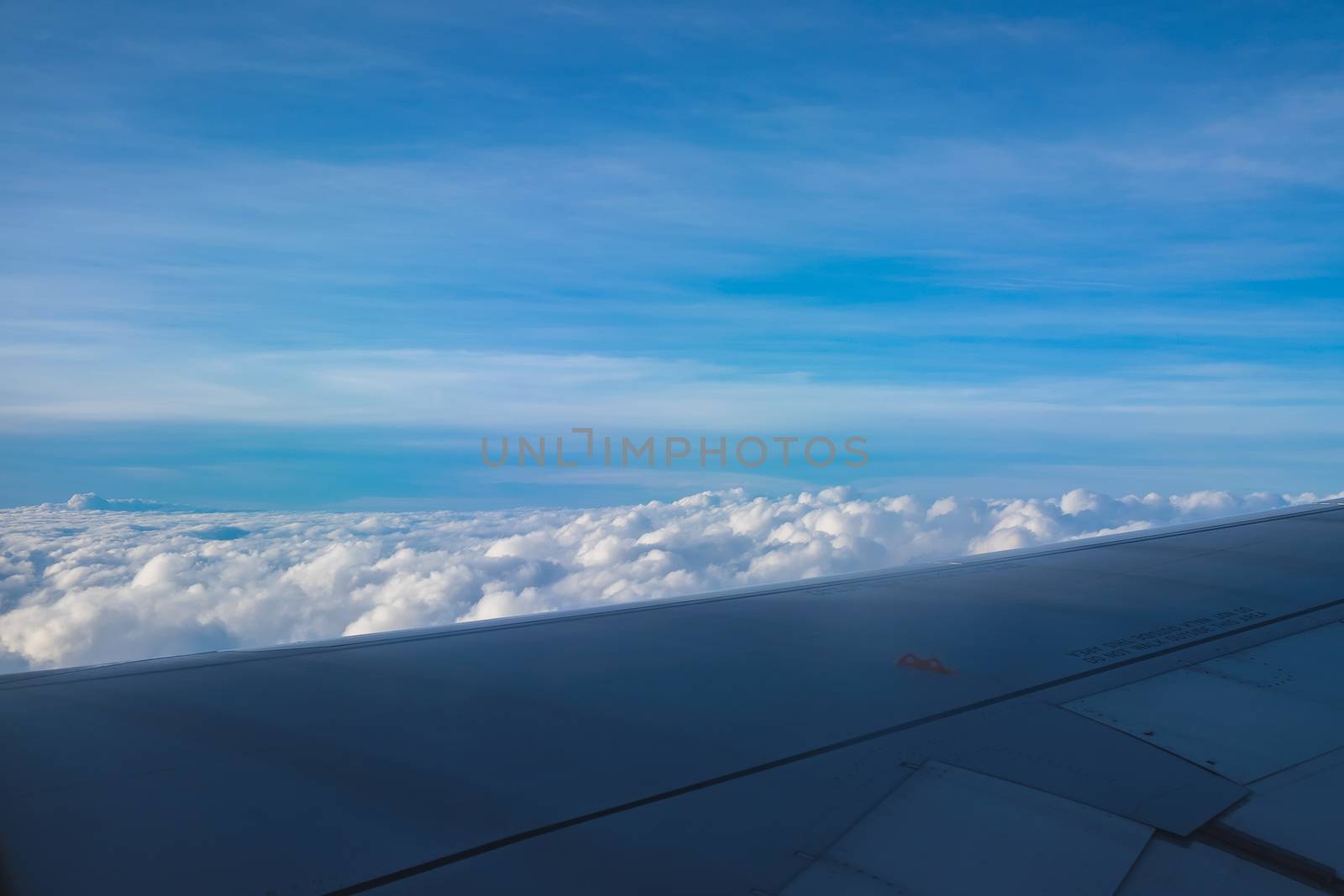 blue sky with cloud view from airplane window by luckyfim