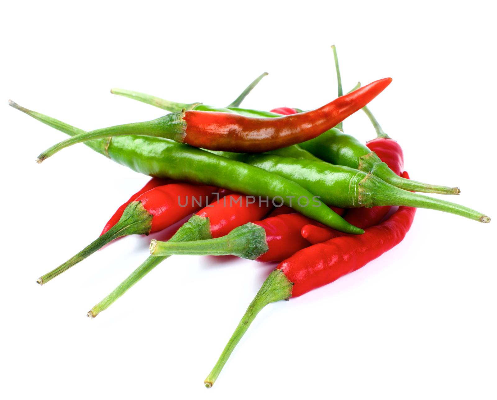 Arrangement of Perfect Red and Green Hot Chili Peppers isolated on White background