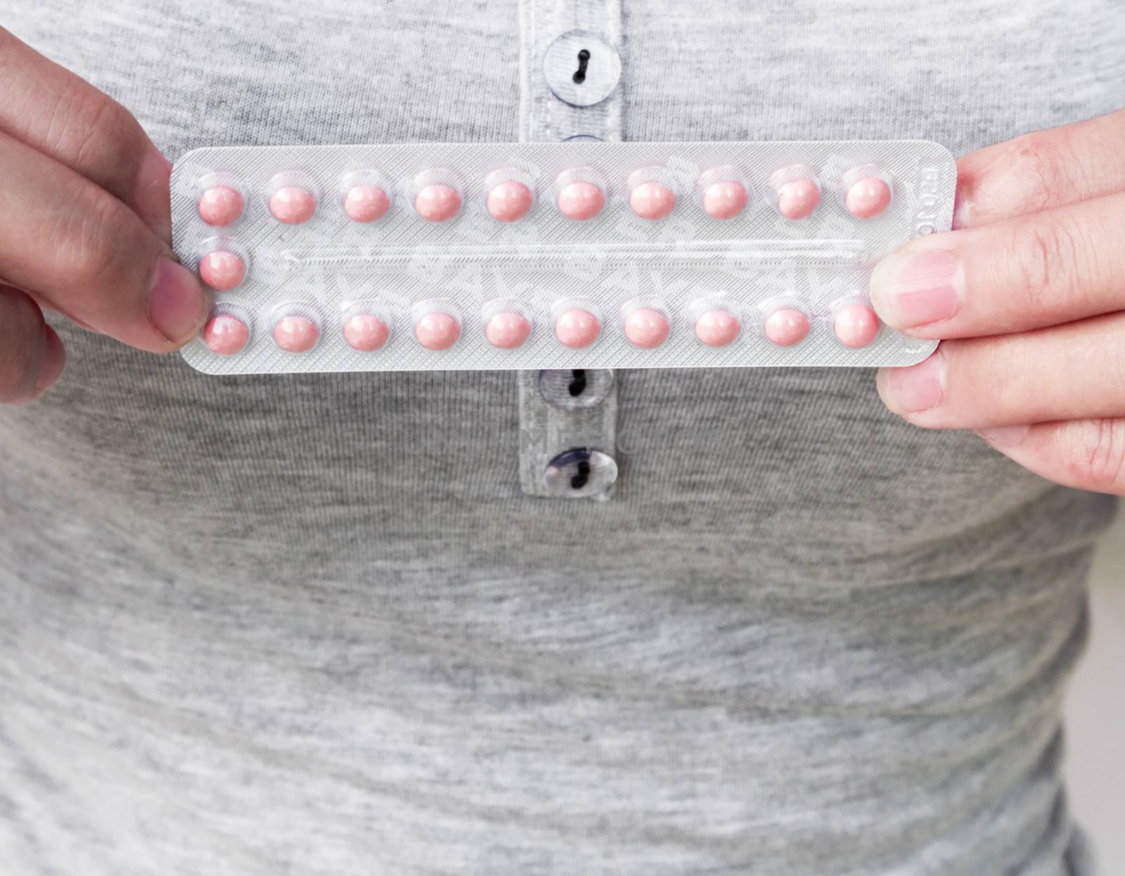 Close up hand hold birth-control pill for health care and medicine concept