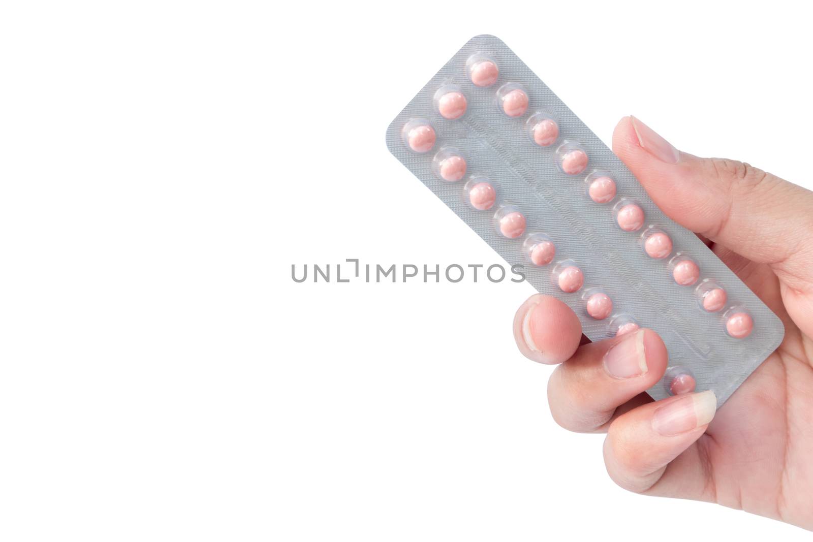 Close up hand hold birth-control pill on white background, health care and medicine concept
