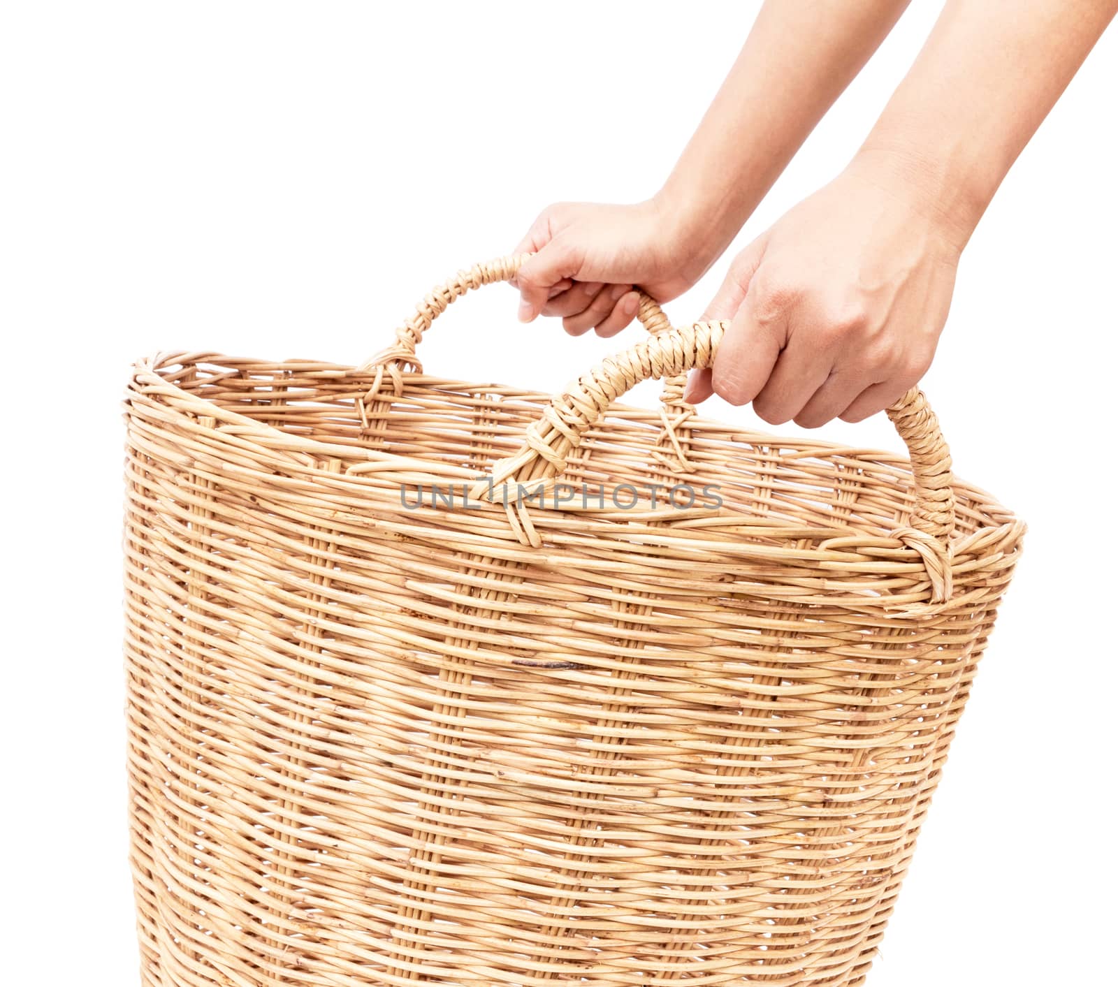 Woman's hand hold the wicker baskets on white background