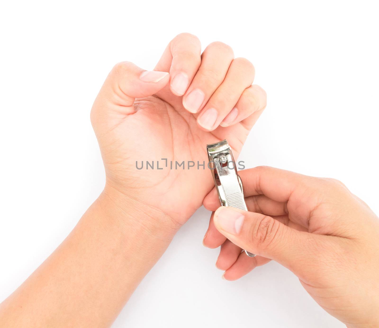 Closeup women cut fingernails on white background