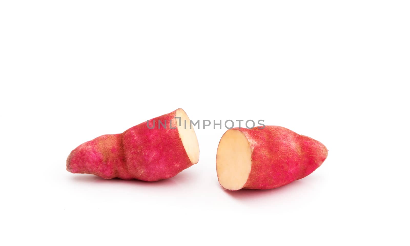 Sweet potato and slice on white background