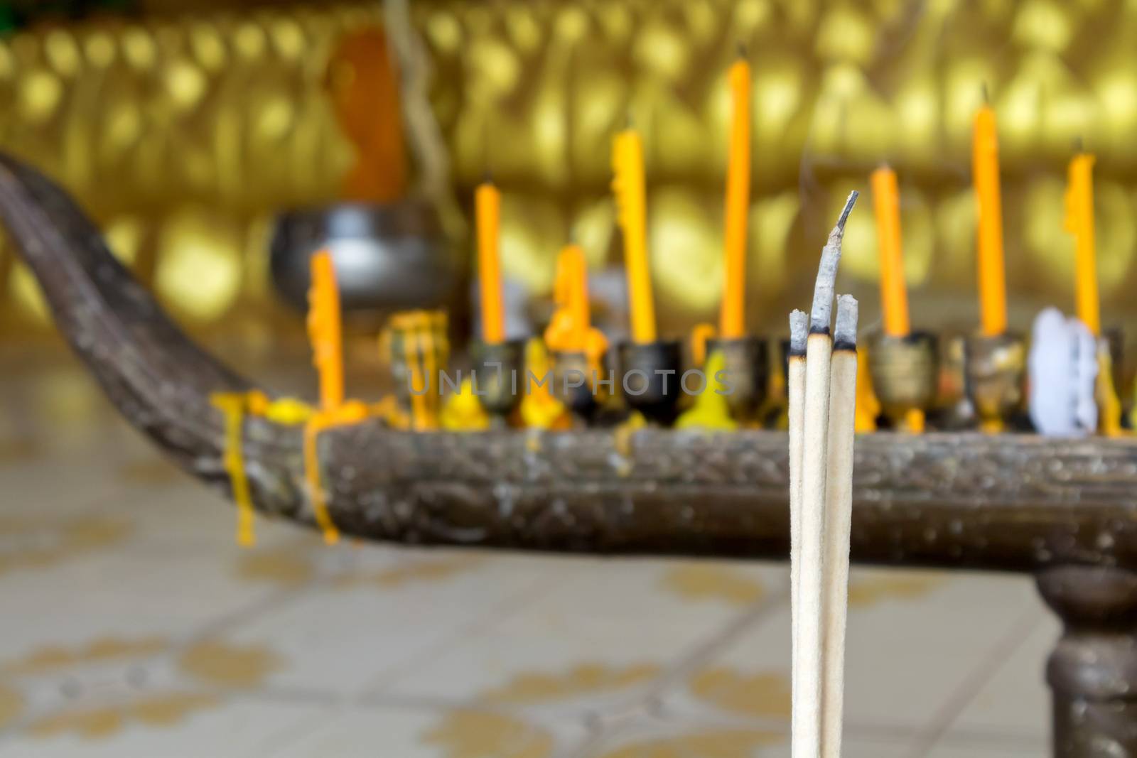 Closeup incense sticks(joss sticks) burning in the temple