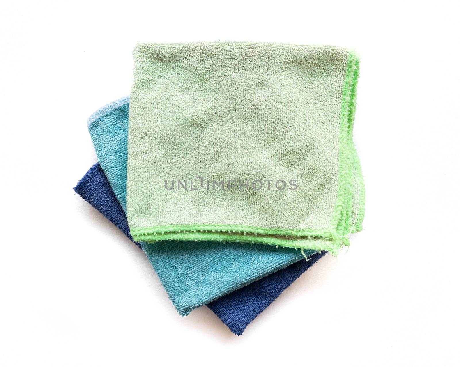 Pile of microfiber cloth for clean on white background, housework concept
